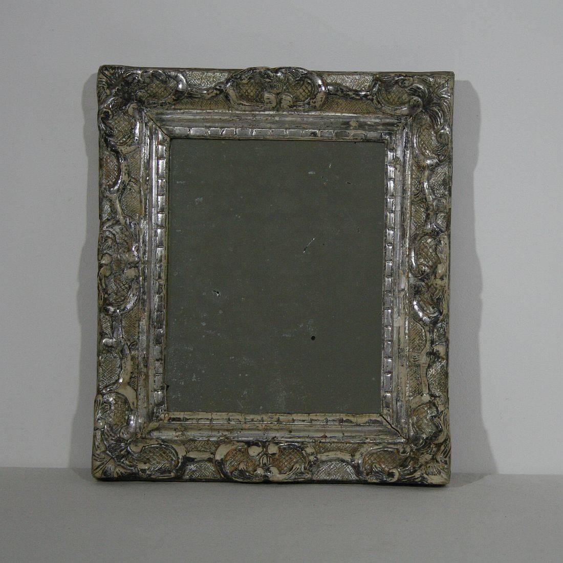 Great mirror with its original silver
France, circa 1750
weathered, small losses.