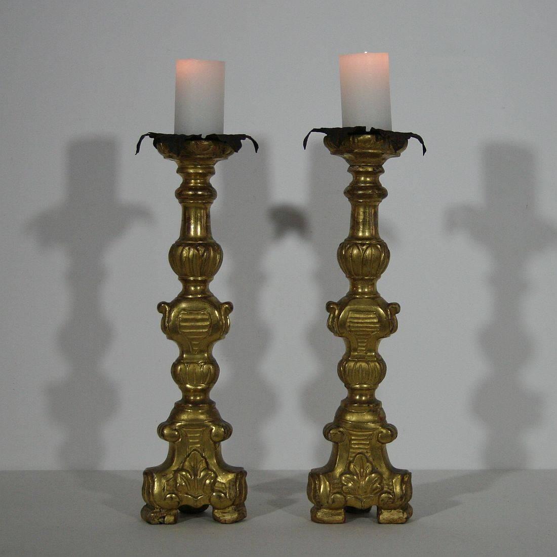 Great pair of carved wooden and gilded candleholders
Italy, circa 1750
Weathered, small losses and old repairs.
More pictures are available on request.