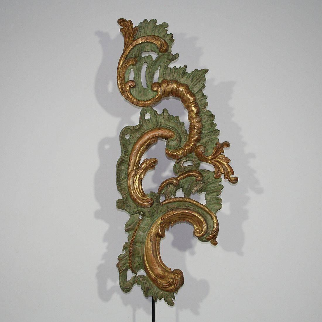 Beautiful and one of a kind piece. Carved wooden curl with traces of its gilding.
Italy, circa 1750.
Weathered, old repairs and losses on the paint.
Measurement is with the wooden base.
More pictures available on request.