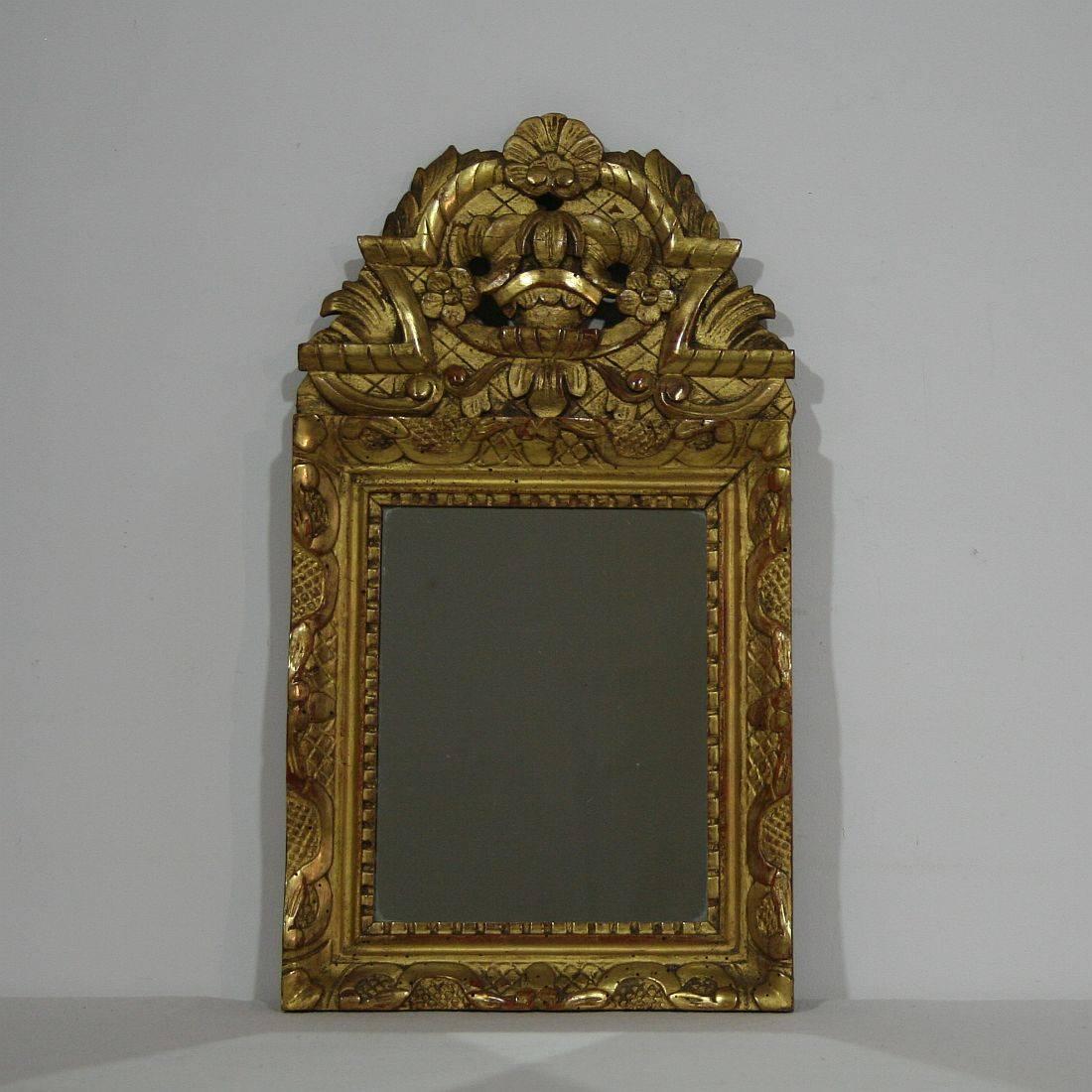 Small carved giltwood Louis XV style mirror.
France, circa 1850.