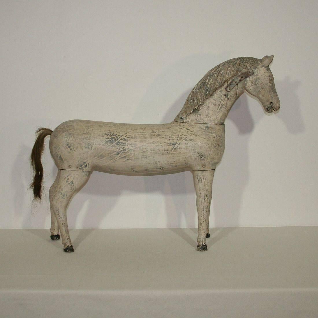 Beautiful and unique Folk Art wooden horse. Great form, patina and with wood pegs
France circa 1750-1850
Weathered and great old repairs.
More pictures are available on request.