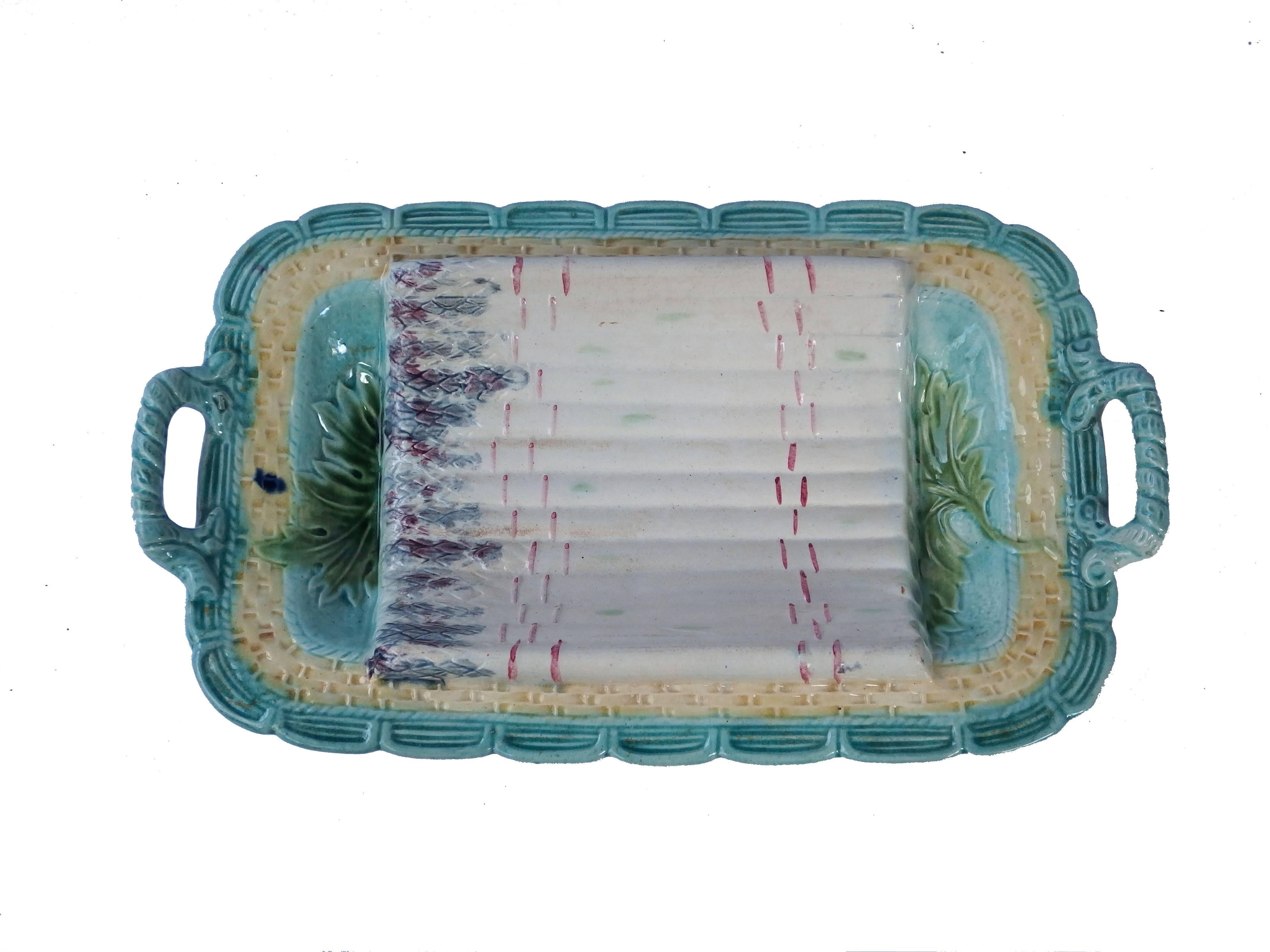 French Majolica asparagus set consisting of one dish and ten plates.
Dimensions: Dish 40 x 25cm, plates diameter 24cm.