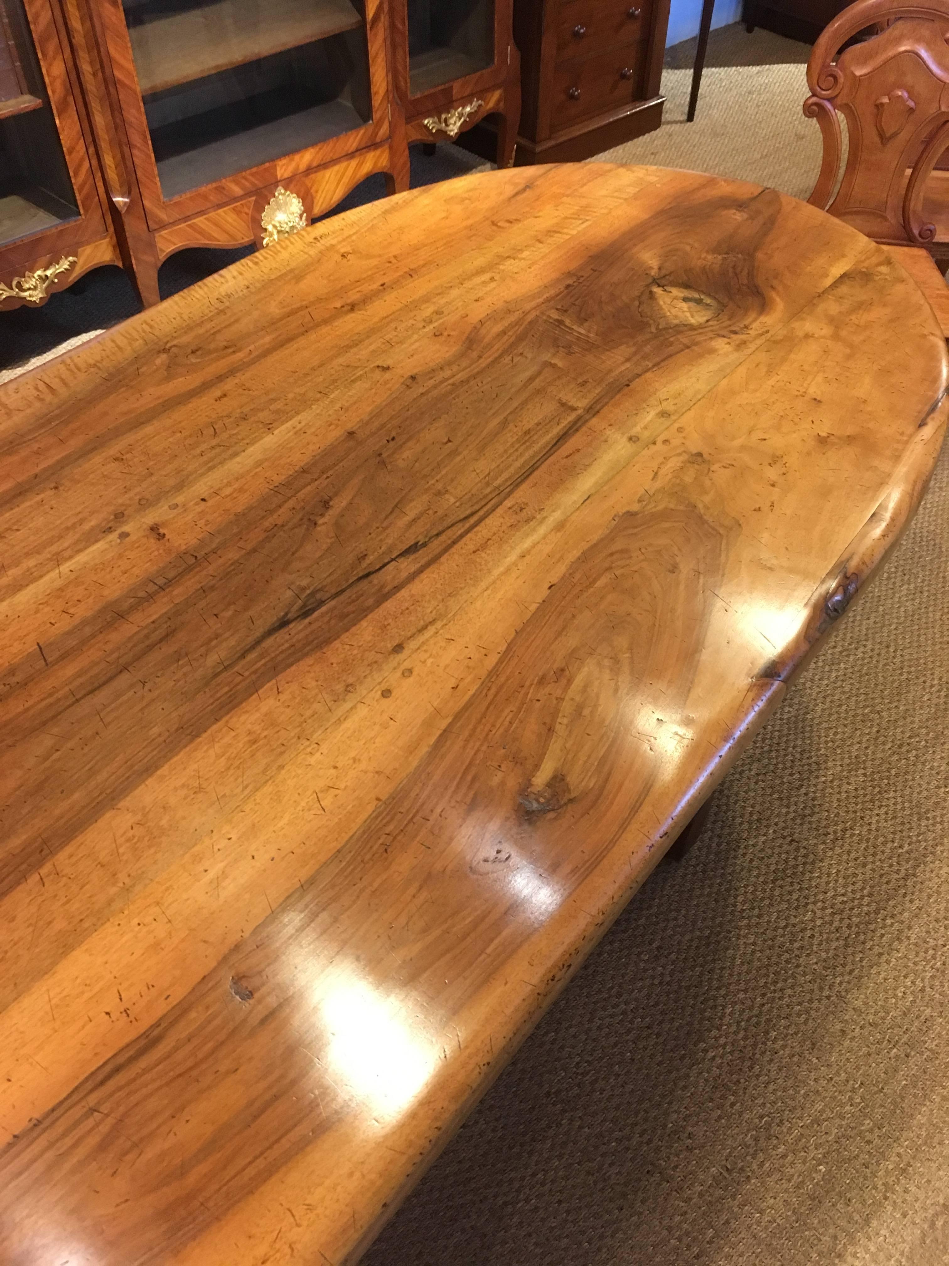 Wonderful solid walnut refectory table, fabulous figured top standing on turned legs 

This table dates to around the 1950s-1960s we have put this table through our workshops and it been cleaned and waxed to enhance the beauty or the