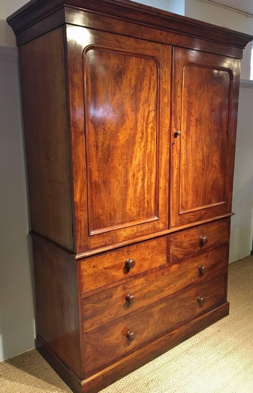 Fine quality mahogany linen press, English, circa 1870. This is an exceptionally
clean press, well looked after by former owners and is shown here in best condition.

Made by Heals in the 19th century, this linen press has superb richly