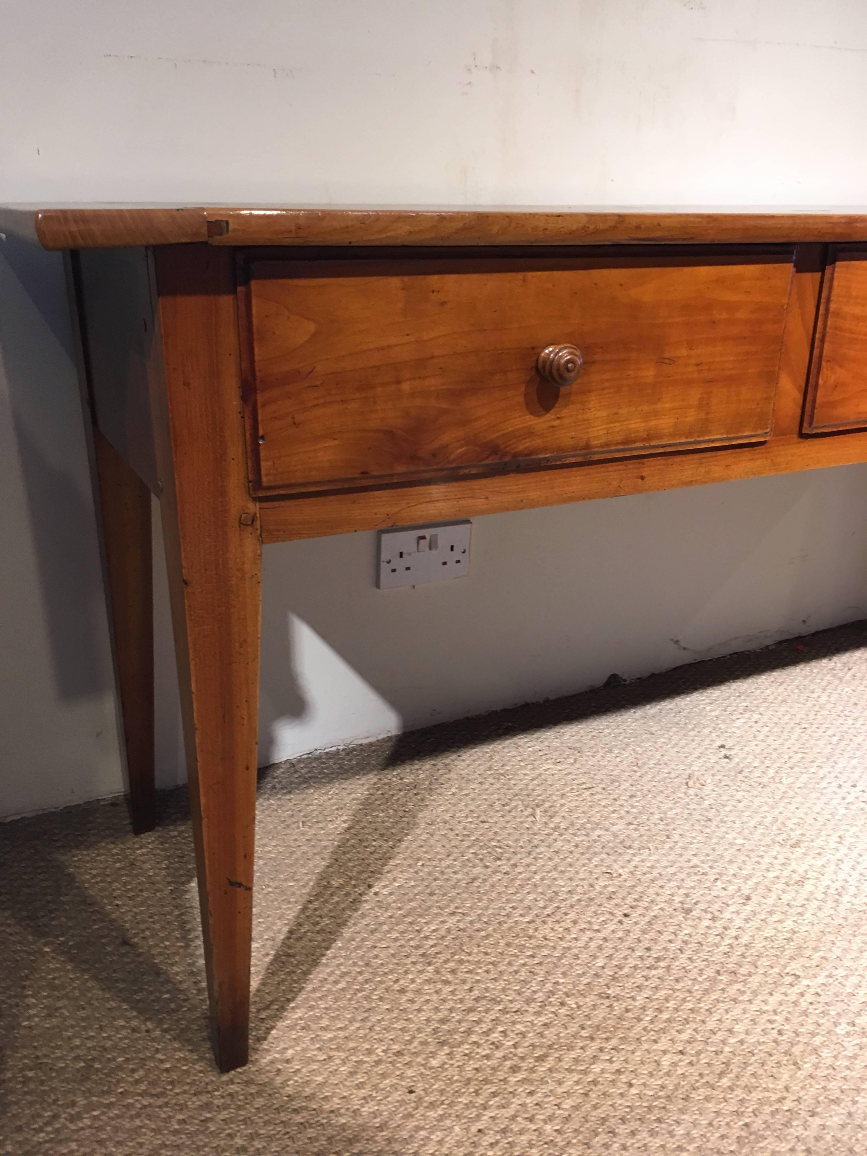 Fabulous neat sized 19th century cheerywood server or dresser base 

French dating circa 1860s having original turned handles solid cheerywood 

The drawers are lined with chestnut and cherry, the planked top having cleated ends 

Has been