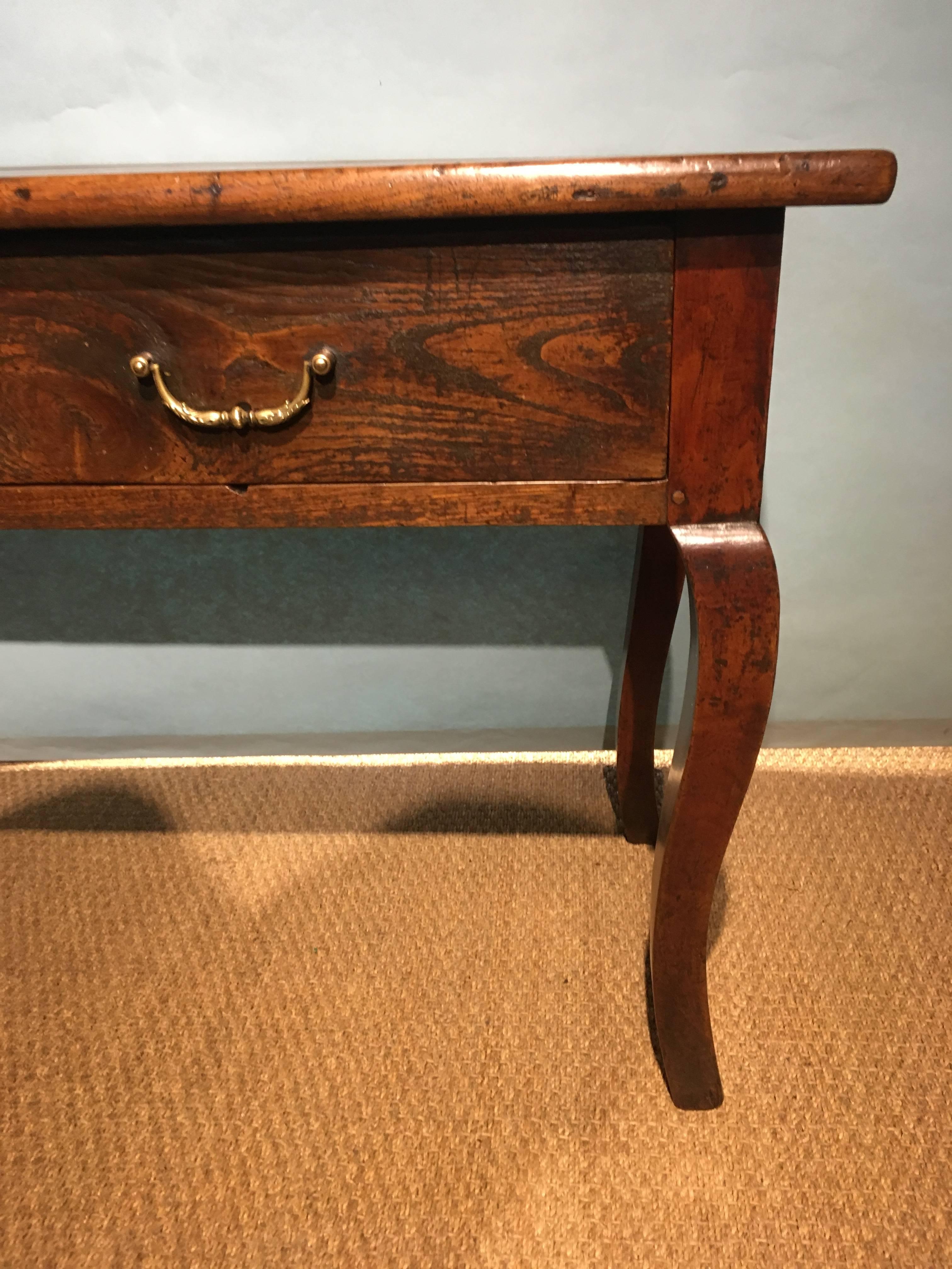 Wonderful small chestnut and cherrywood legged server / side table. 


French, circa 1850s having original brass handles (you can see the indentations these have left on the drawer fronts).

This piece has been through our workshops been