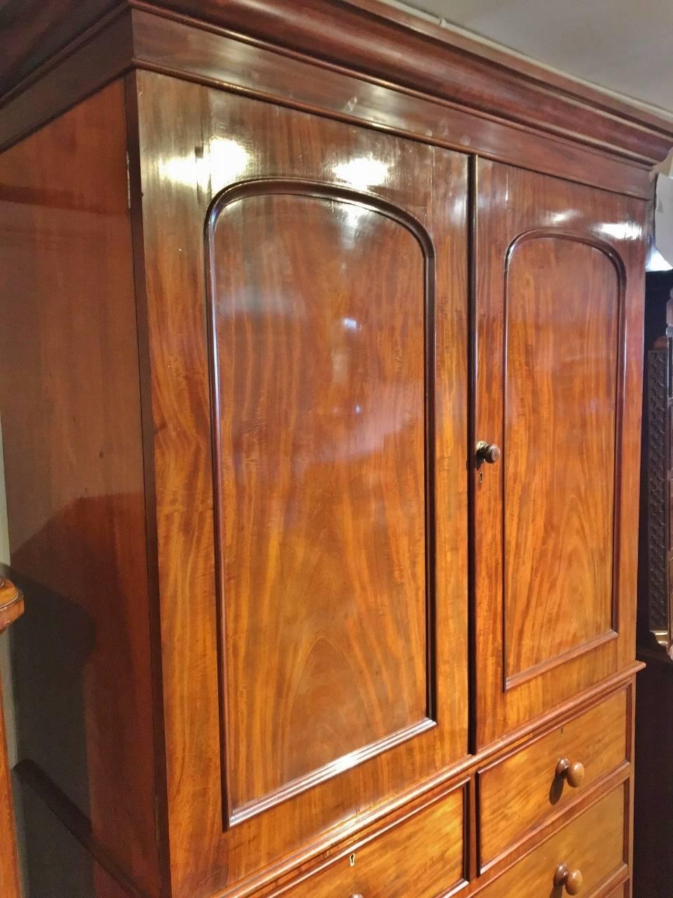 Fine quality mid-19th century mahogany linen press, English, circa 1860.

This delightful linen press, well maintained by former owners is shown here in excellent condition, having been lightly refurbished and wax polished to show its beautiful