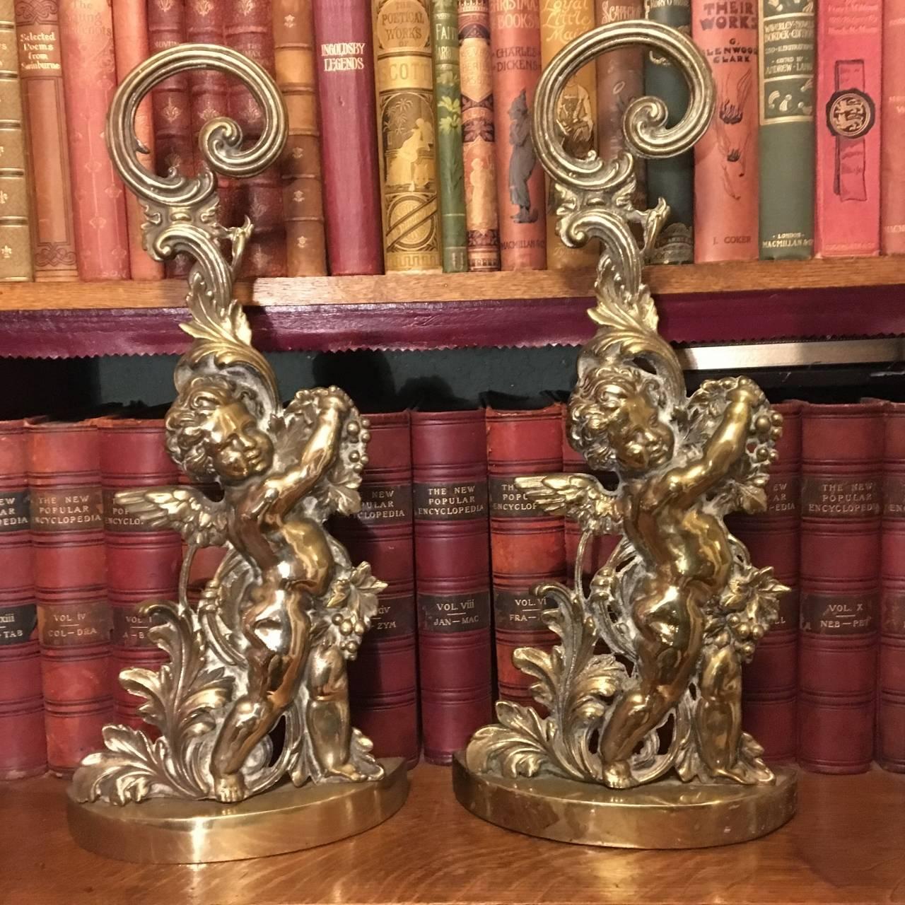 Cast Two Early 20th Century Brass Cherub Door Stops