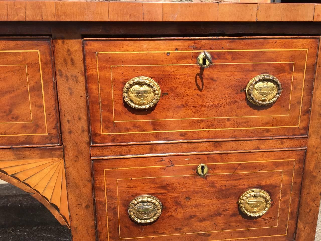 This is an absolutely delightful antique Georgian sideboard, English, circa 1800.The colour and patination is a pleasure to behold. It is such a useful item having plenty of storage and as a Server.
 
There are two drawers on the top left, a single