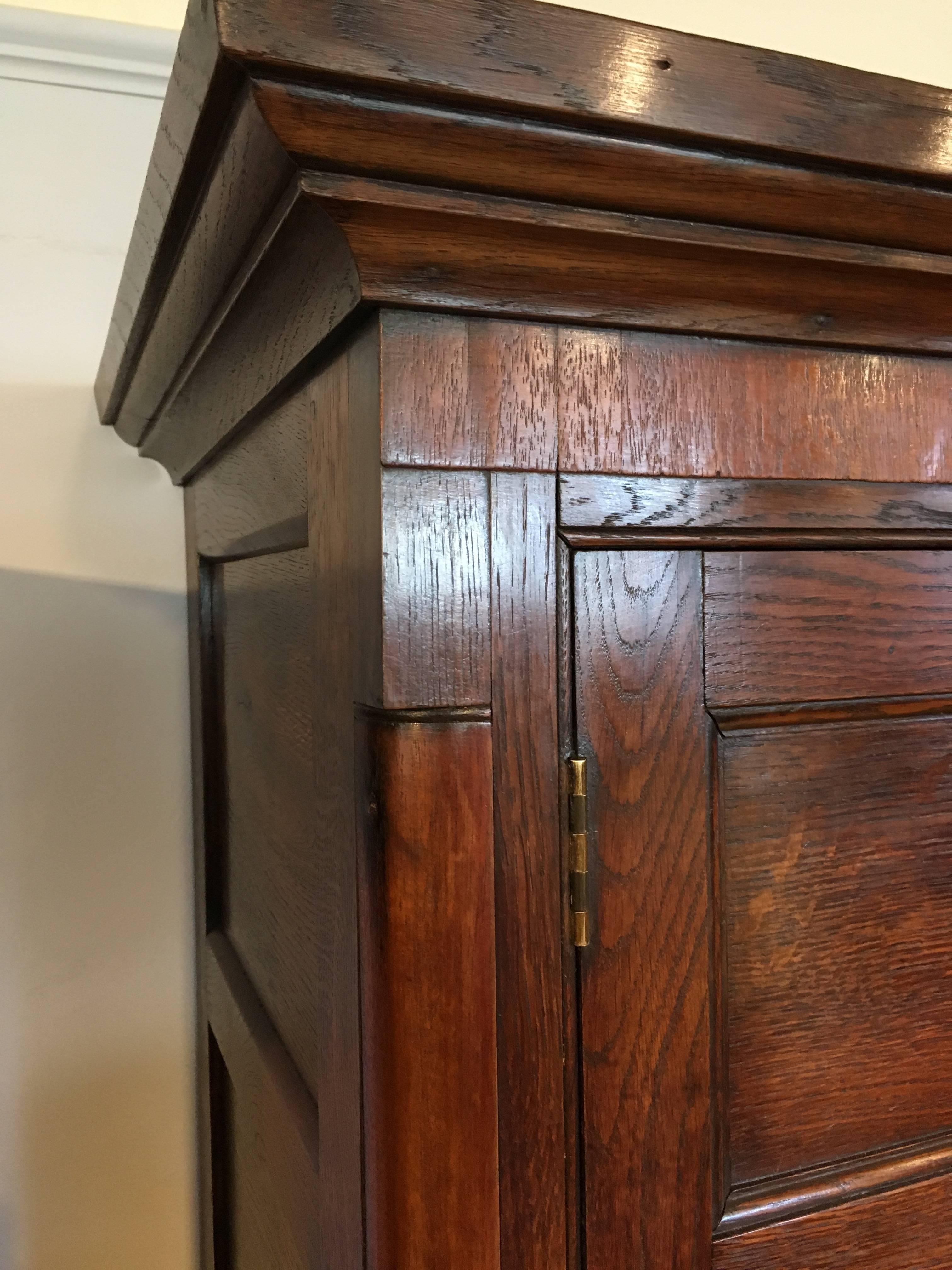 Good early 19th century linen press/housekeepers cupboard 

Dating to around the 1800s constructed from mainly solid oak with pine backing and drawer linings 

This piece has been through our workshops cleaned and polished all the drawers run