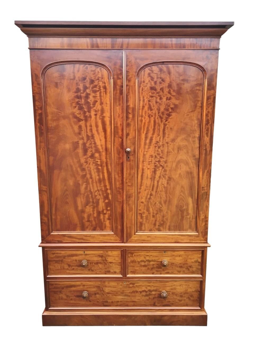Fine quality two door mahogany compactum wardrobe superbly fitted out. 

This delightful antique wardrobe is extremely useful and has been well maintained. There are three deep and smoothly running drawers in the base, constructed using the best