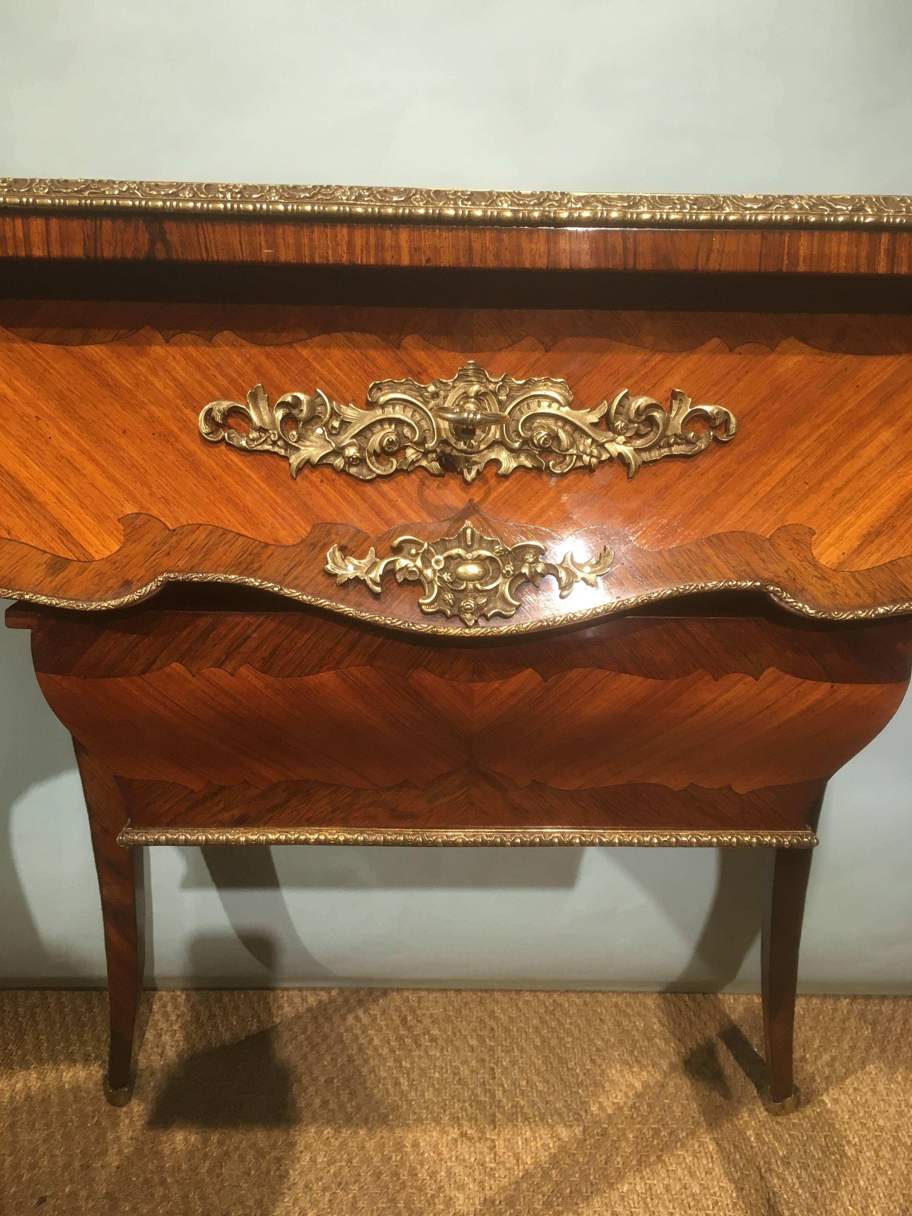 Very fine 19th century king wood dressing table or work table banded with figured wall and having original ormolu mounts 

Although unsigned this is a 