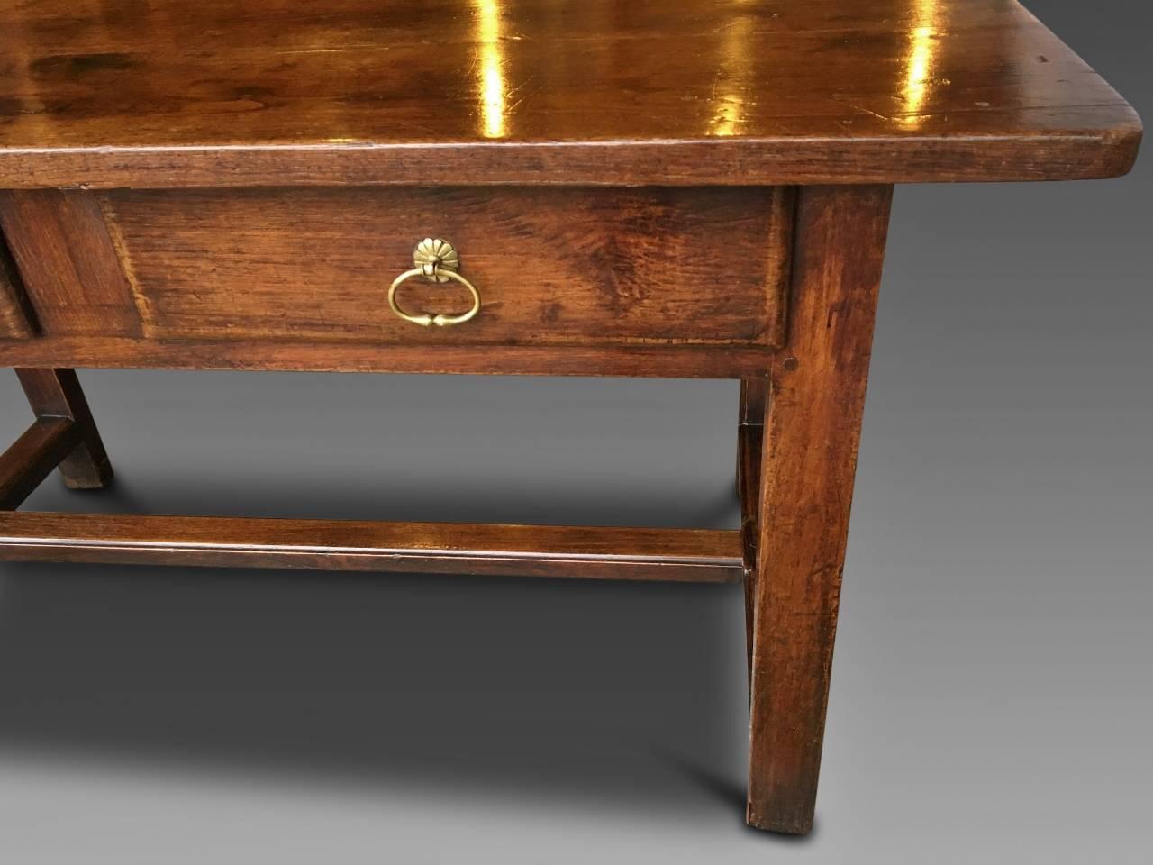 A most attractive mellow oak serving table / side table from the early circa 1800s.
This table is French and in excellent condition. Pegged and jointed, all the joints are strong and firm. The drawers run smoothly and have their original brass