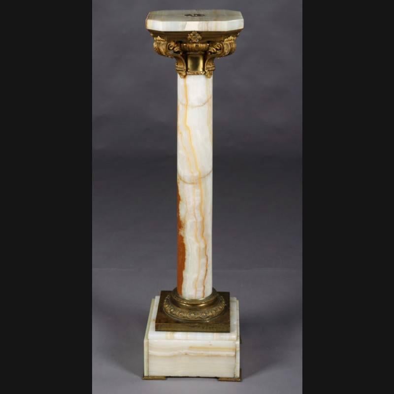 Onyx column in the style of classicism Napoleon III, Paris, circa 1850-1880.
The high-quality, chased, fire-gilt bronze are distinctive and of exceptionally good quality. Bright onyx marble with pronounced grain. Square plinth with balustrade