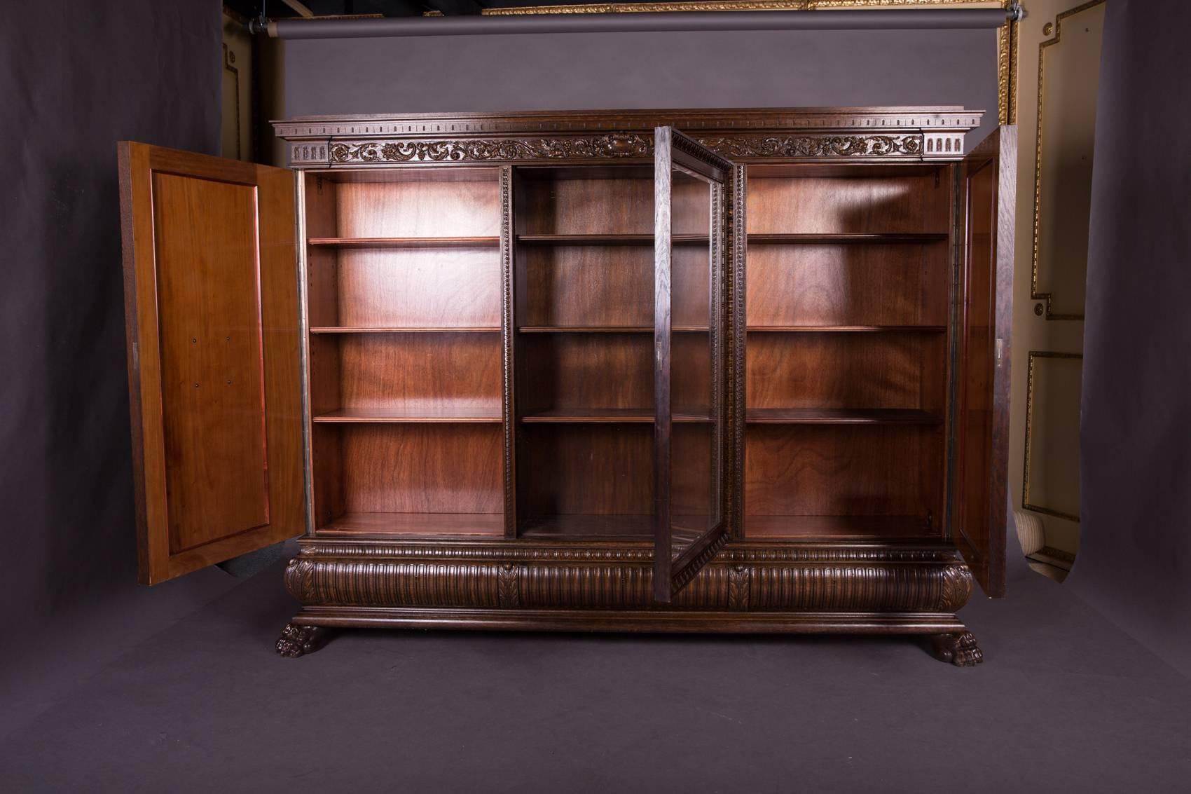 Solid oak with rich carving. Three-door with a drawer each.

(O-229).