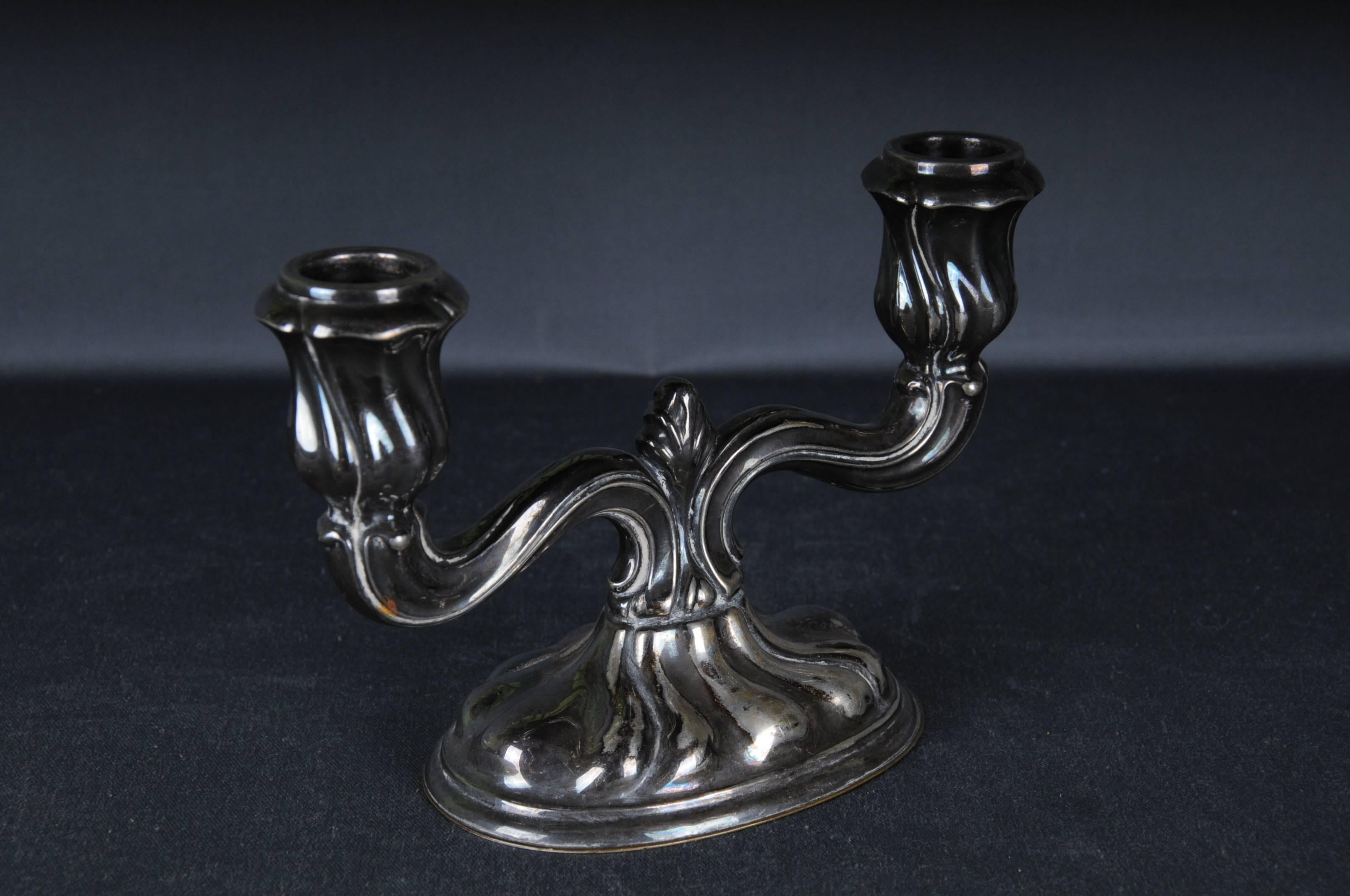 
High quality Silver Candlesticks 835 Germany Heidelberg

2-armed

The candlestick is weighted
Weight: 258 grams

The condition can be seen in the pictures.