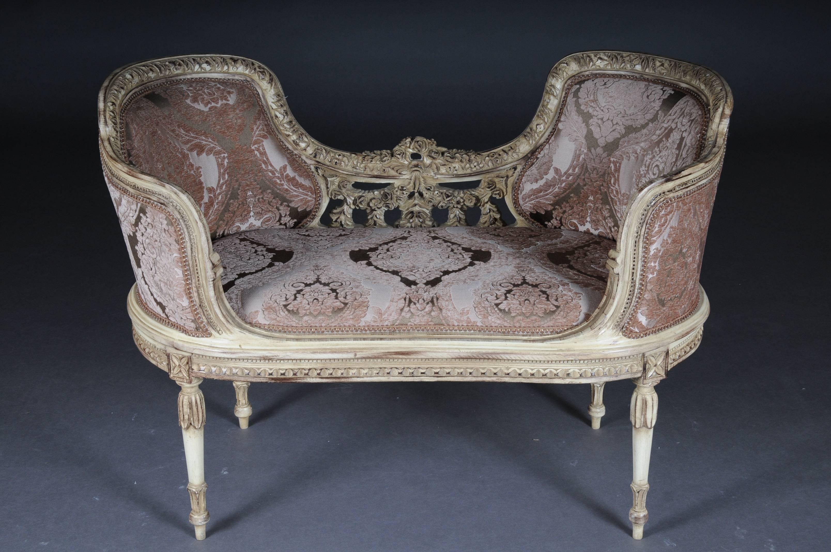 Solid beechwood, carved and gilt gilded. Semicircular rising, curved backrest framing with rocaille crowning. Appropriately curved frame with rich carved foliage. Profiled frame on conical, fluted legs. Seat and backrest are finished with a