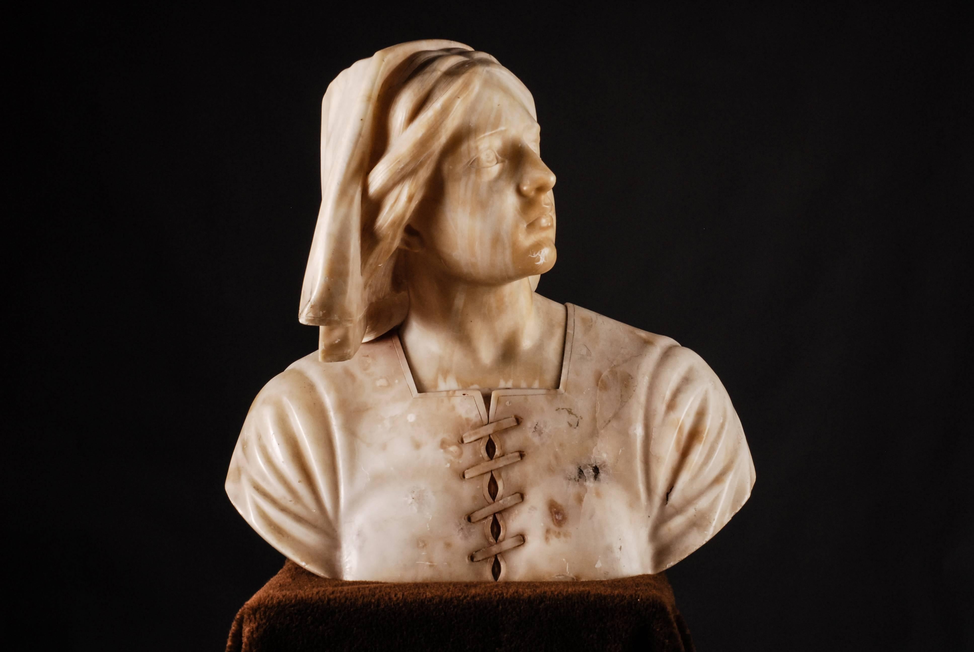 Large bust of a young lady with head covering.
Exactly expressive characterizing representation, the exceptionally detailed also the mimicry of her head.

Jeanne d'Arc is a French national hero. She is venerated in the Roman Catholic church as a