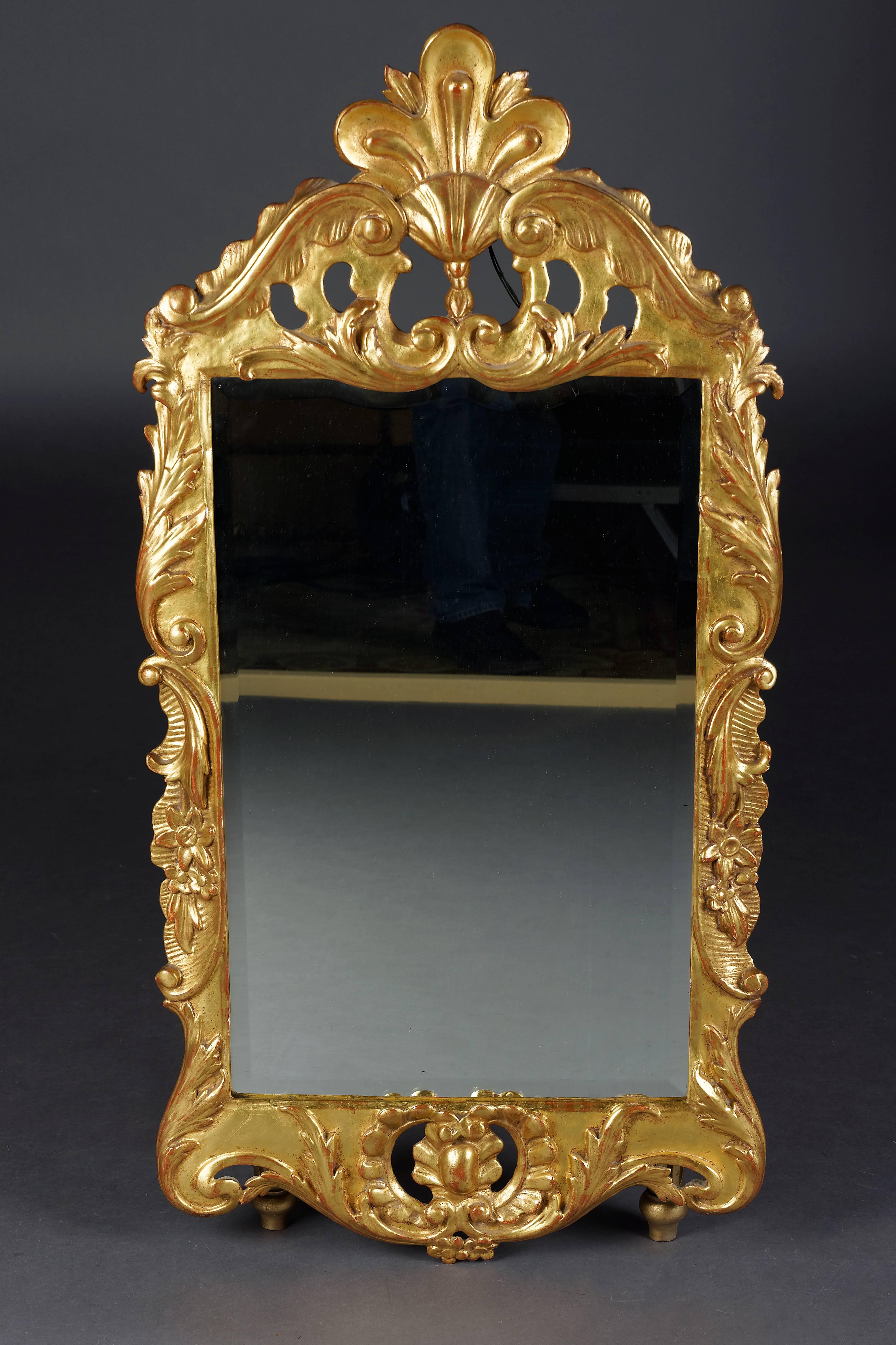 Solid wood carved and leaf gilded. Shaped carved frame. The Giebelfeld is decorated with sculptured carved Baroque elements. Such models can only be found in castles.

(M-14).