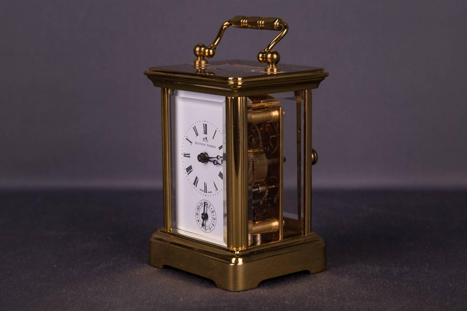 High quality travel watch of the brand Matthew Norman. Weighty body. Brass housing around flanked with polished glass. Also the lid was provided with a glass insert.
Eight days gong with alarm clock wonderful Classic design

Clockwork engraved: M.