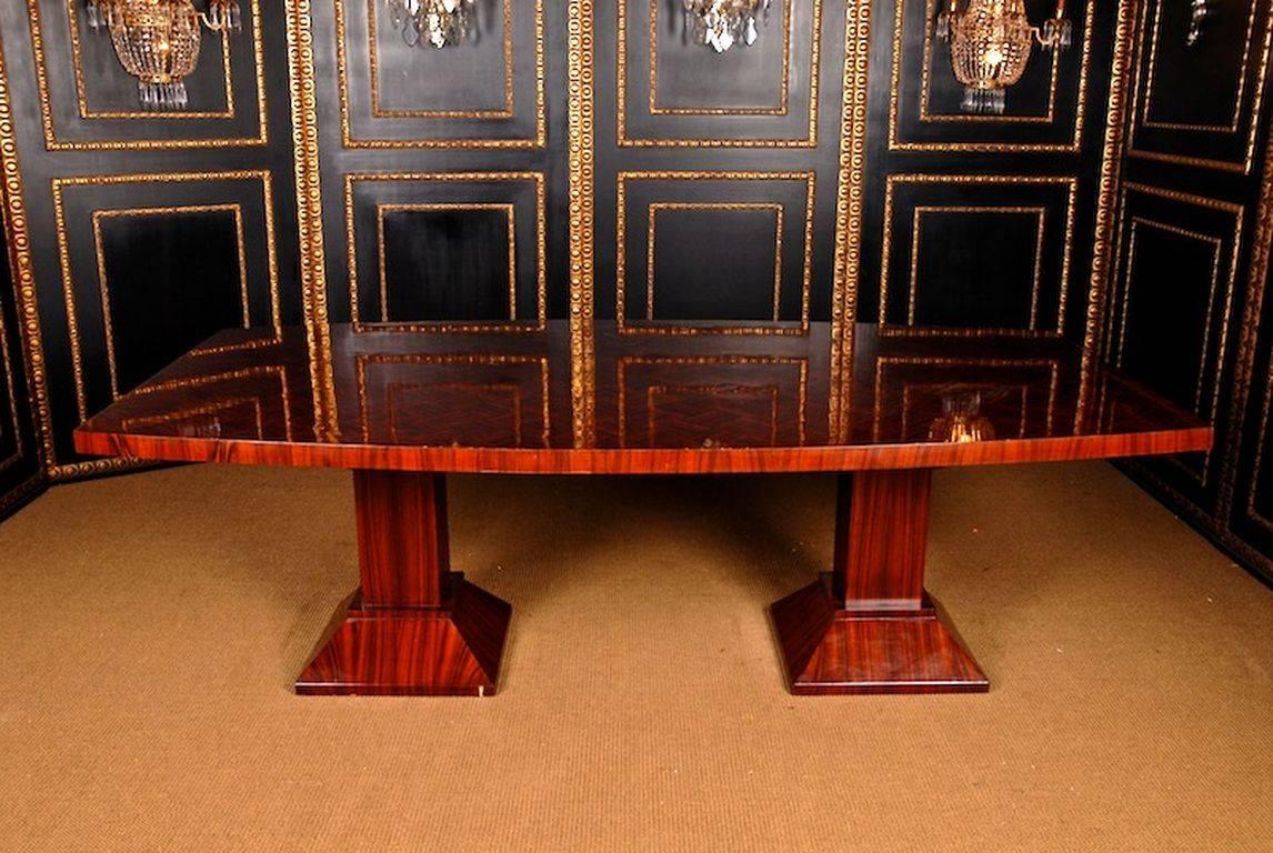 Large conference or dining table in Art Deco style.
 solid pinewood. Oval cover platter on four sided stepped column-shanks.

(A-Mhs-5).