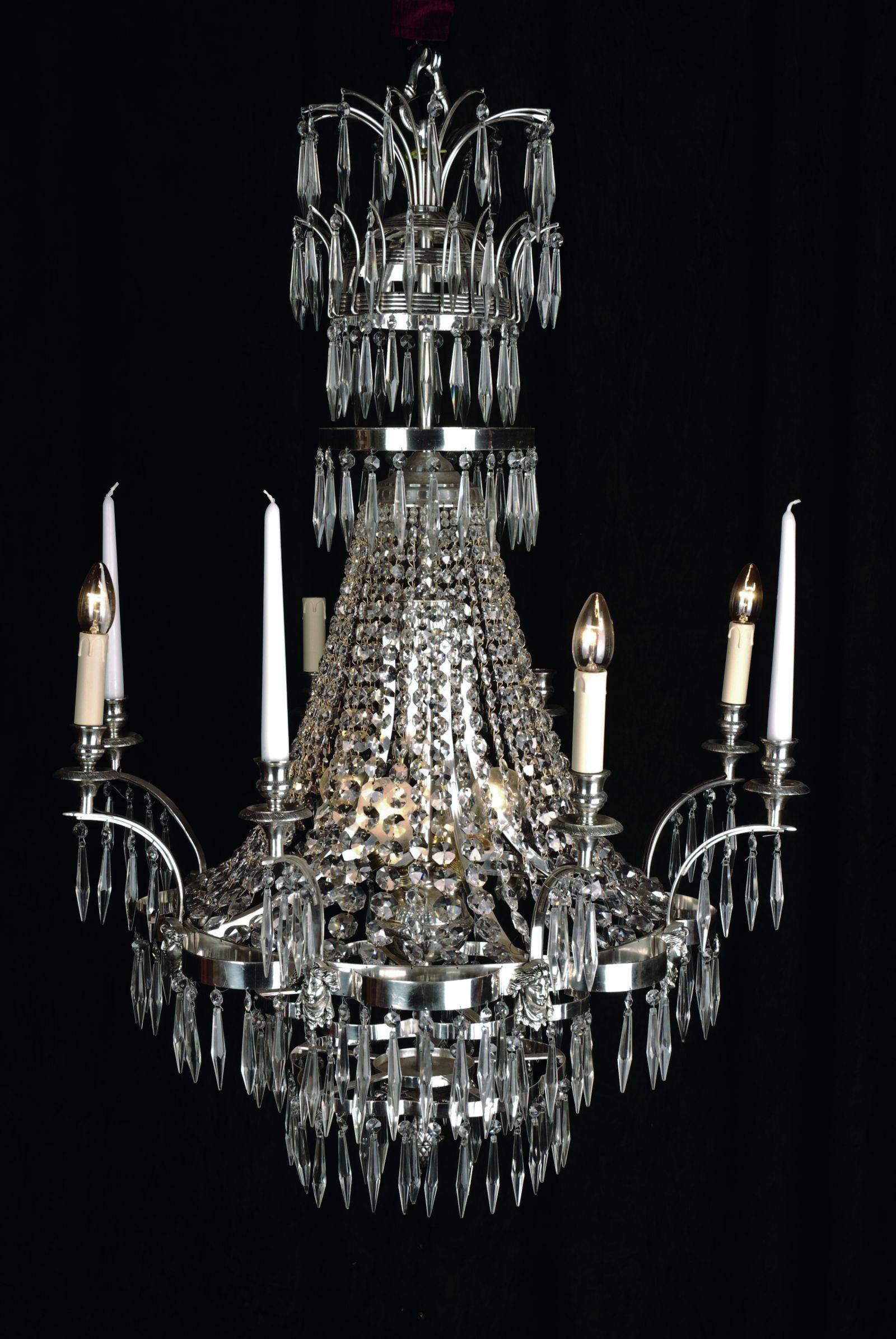 Large Swedish ceiling chandelier in classicist style.
Polished, silvered brass. Facetted glass hangings. 

(F-Ra-60).