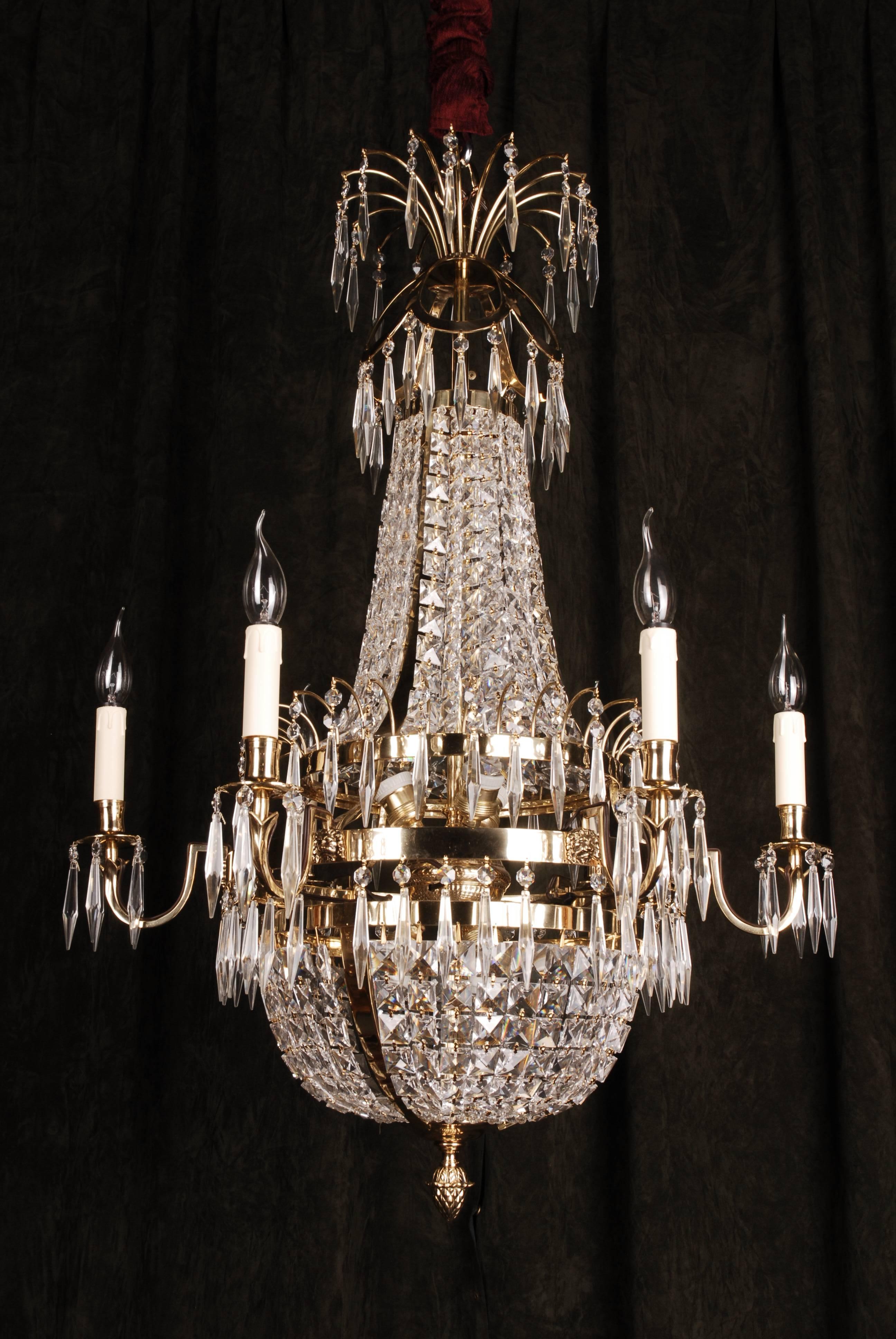 Swedish Empire ceiling candelabra in classicist style.
Polished brass and facet-ground prism hangings.

(F-Ra-80).