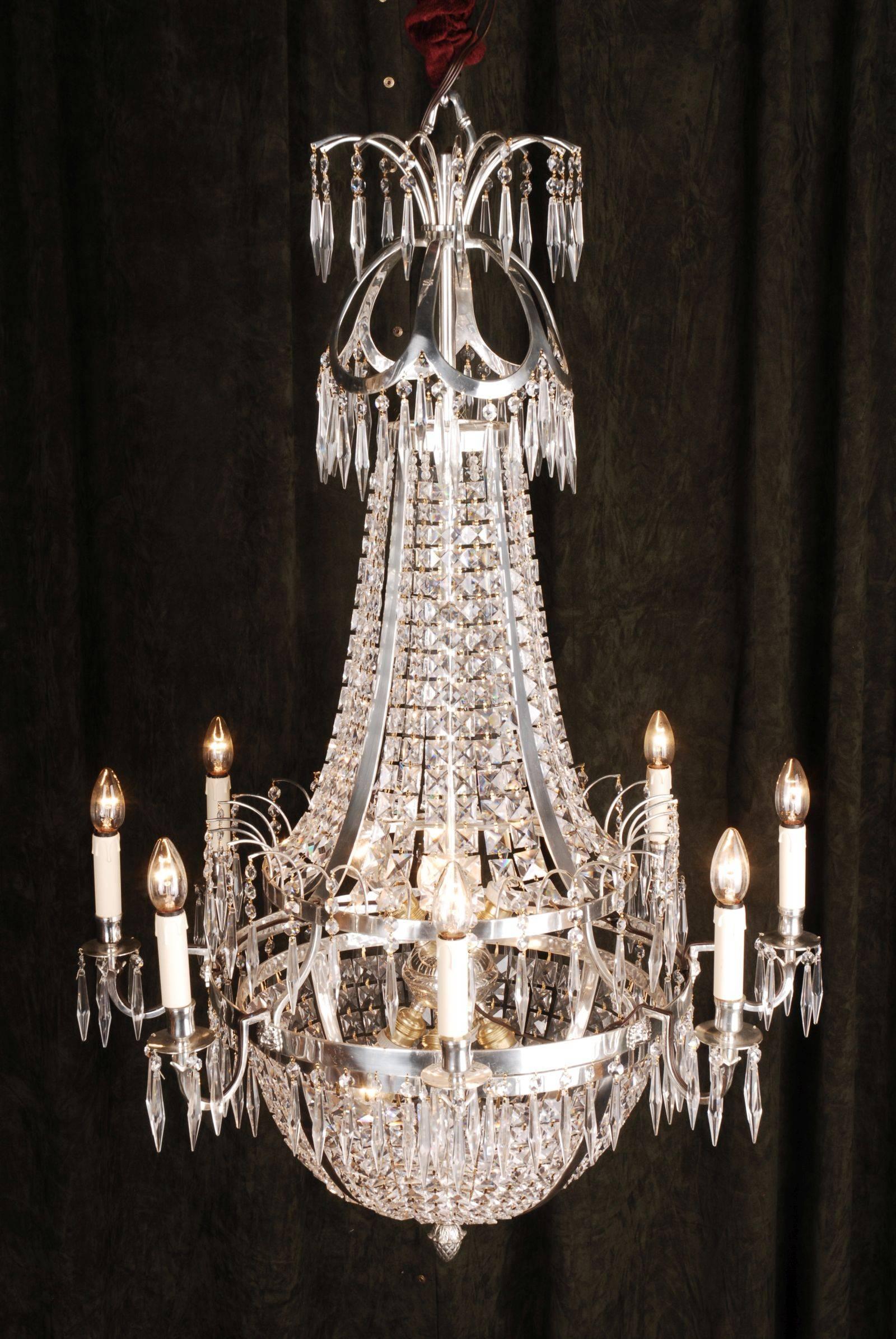 Swedish Empire ceiling candelabra in classicist style.
Polished, silvered brass and facett-ground prism hangings.

(F-Ra-83).