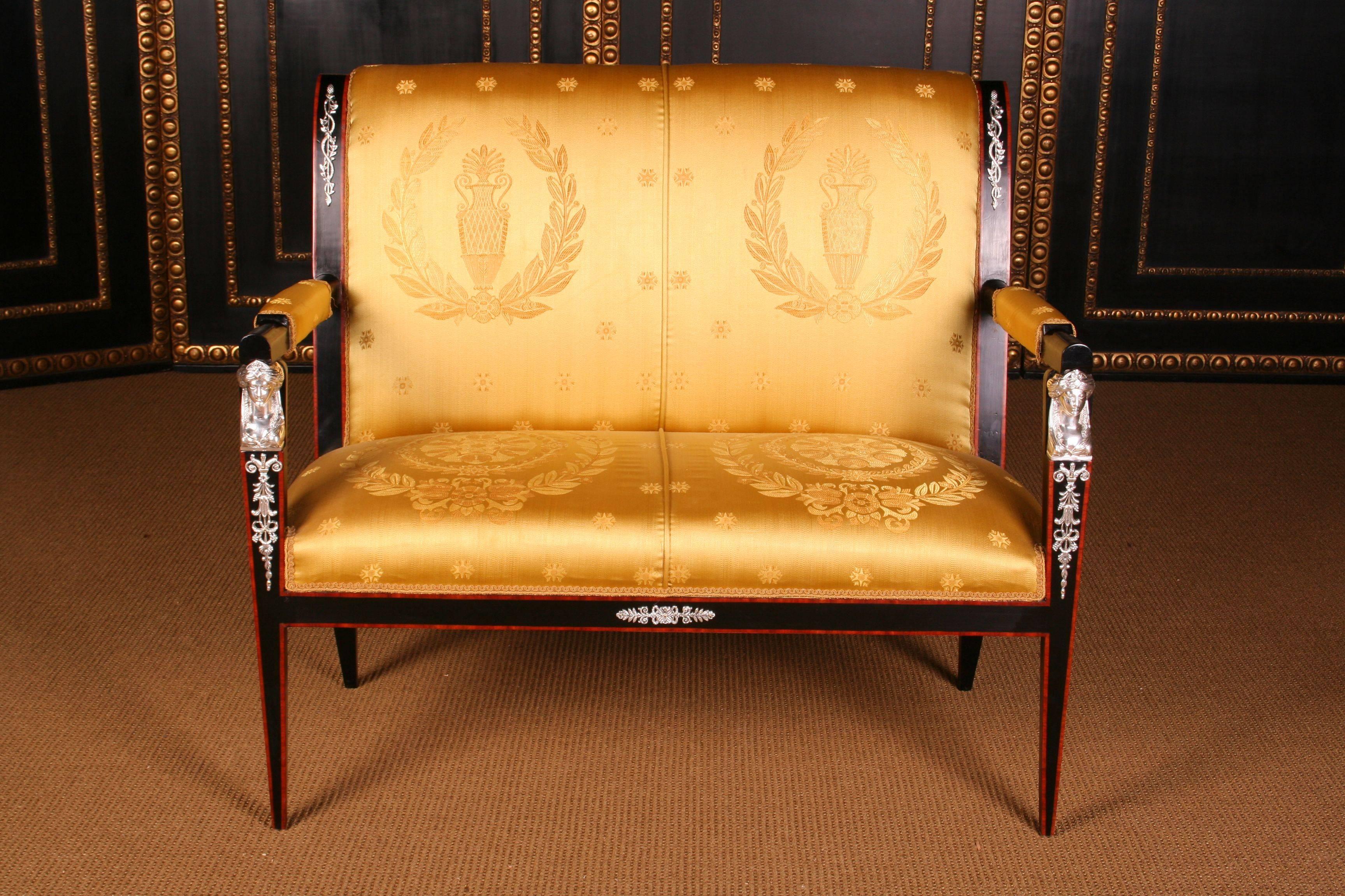 Imperial garniture in French Empire style.
Solid, ebonized beechwood. Fine engraved and silver plated Empire mountings and caryatides.

Measures: Kanapee/sofa: Width 108 cm, height 98 cm, depth 65 cm
Armchair: Width 56 cm, height 98 cm, depth 62