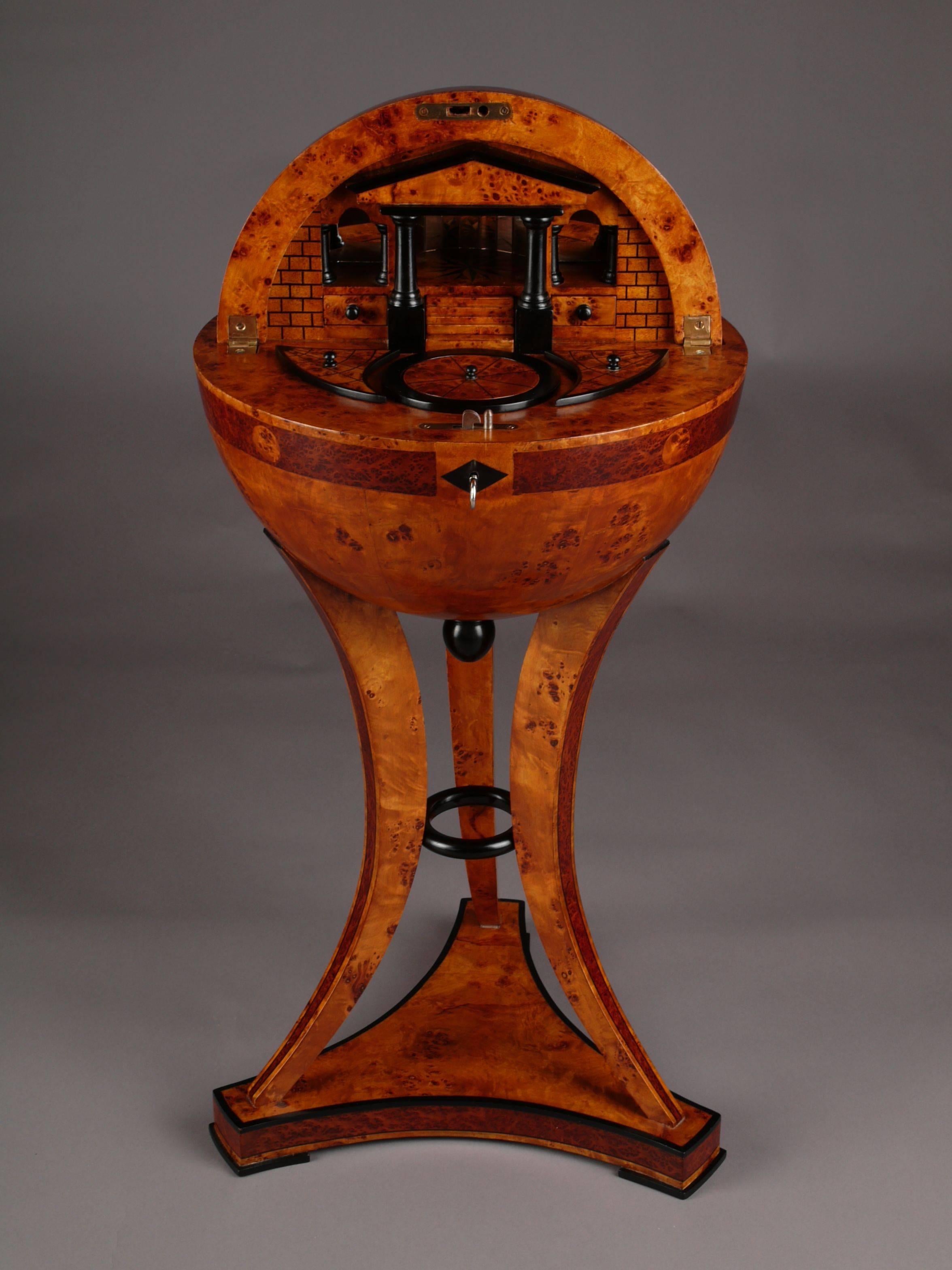 Highly significant globe sewing table in Vienna Biedermeier style.
Bird's-eye maple root marquetry on solid beech, partially ebonized.

(G-Sam-40).
 