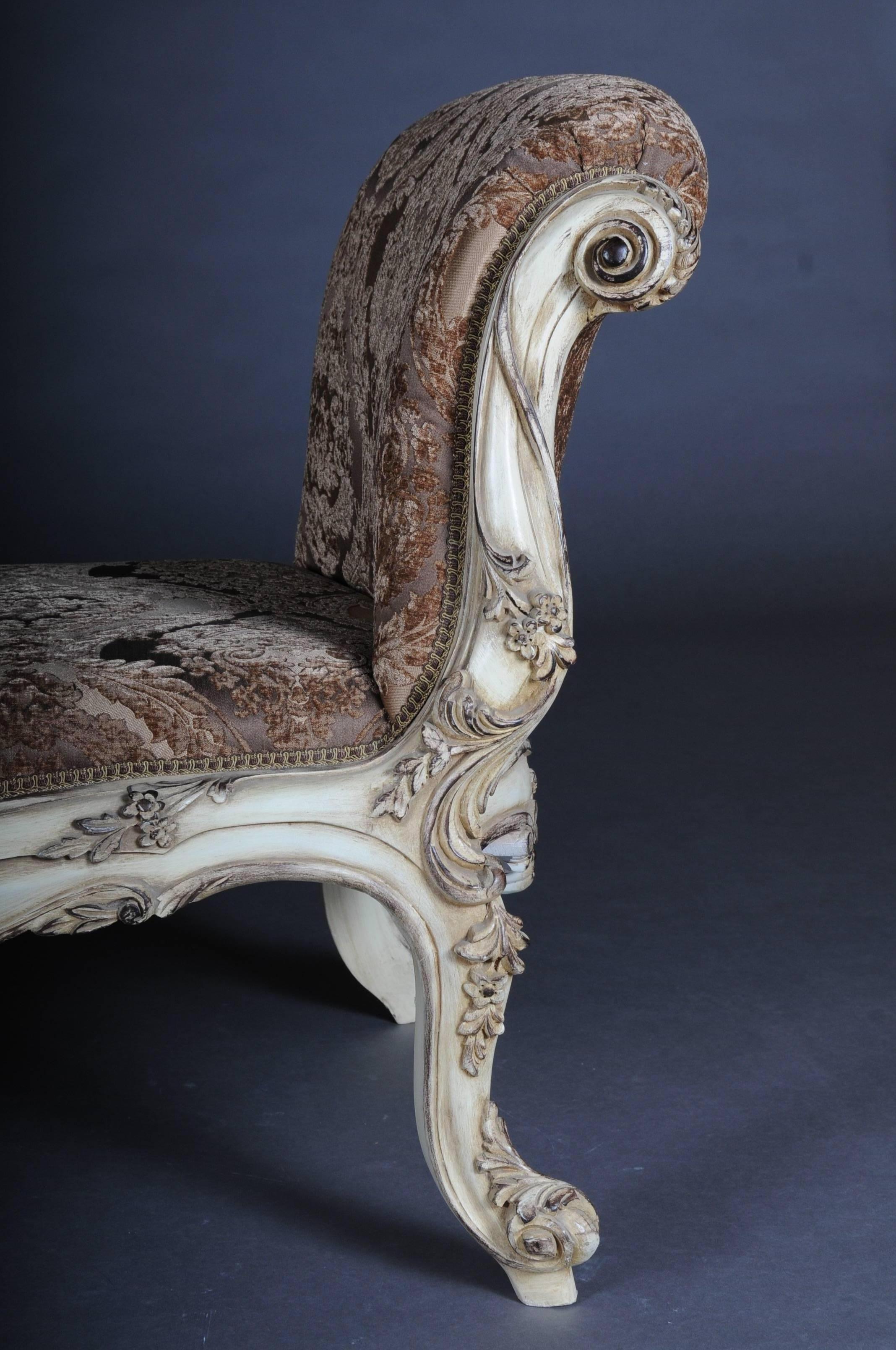 Solid beechwood, gilded with gold-plated trim, snug curly frame on four curved legs. The seat is finished with a historical, classic upholstery..