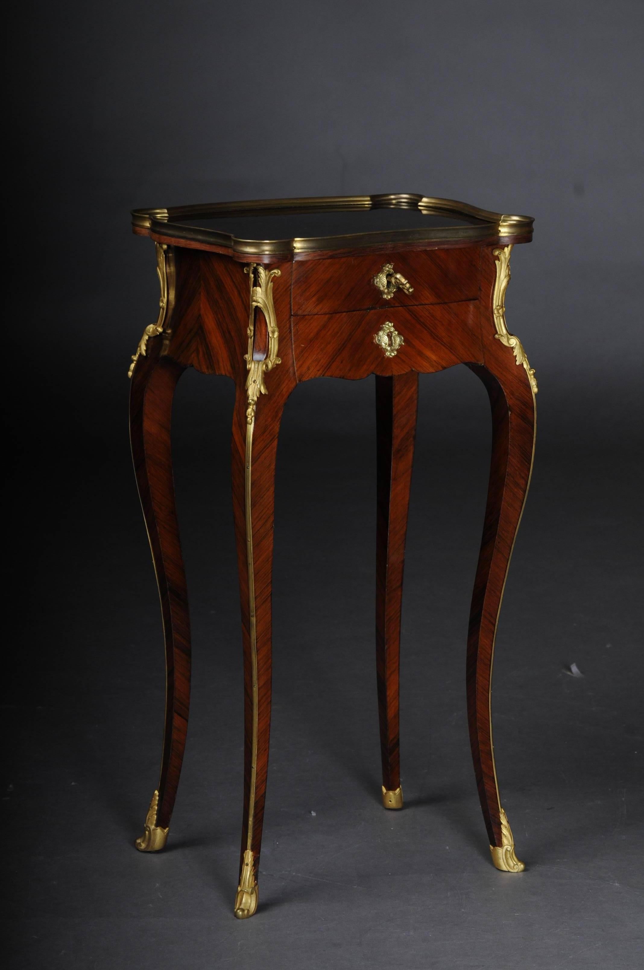 Solid woodFire-gilt fittings. Two drawers carcase ending on long curved legs in sabots.


(G-73).