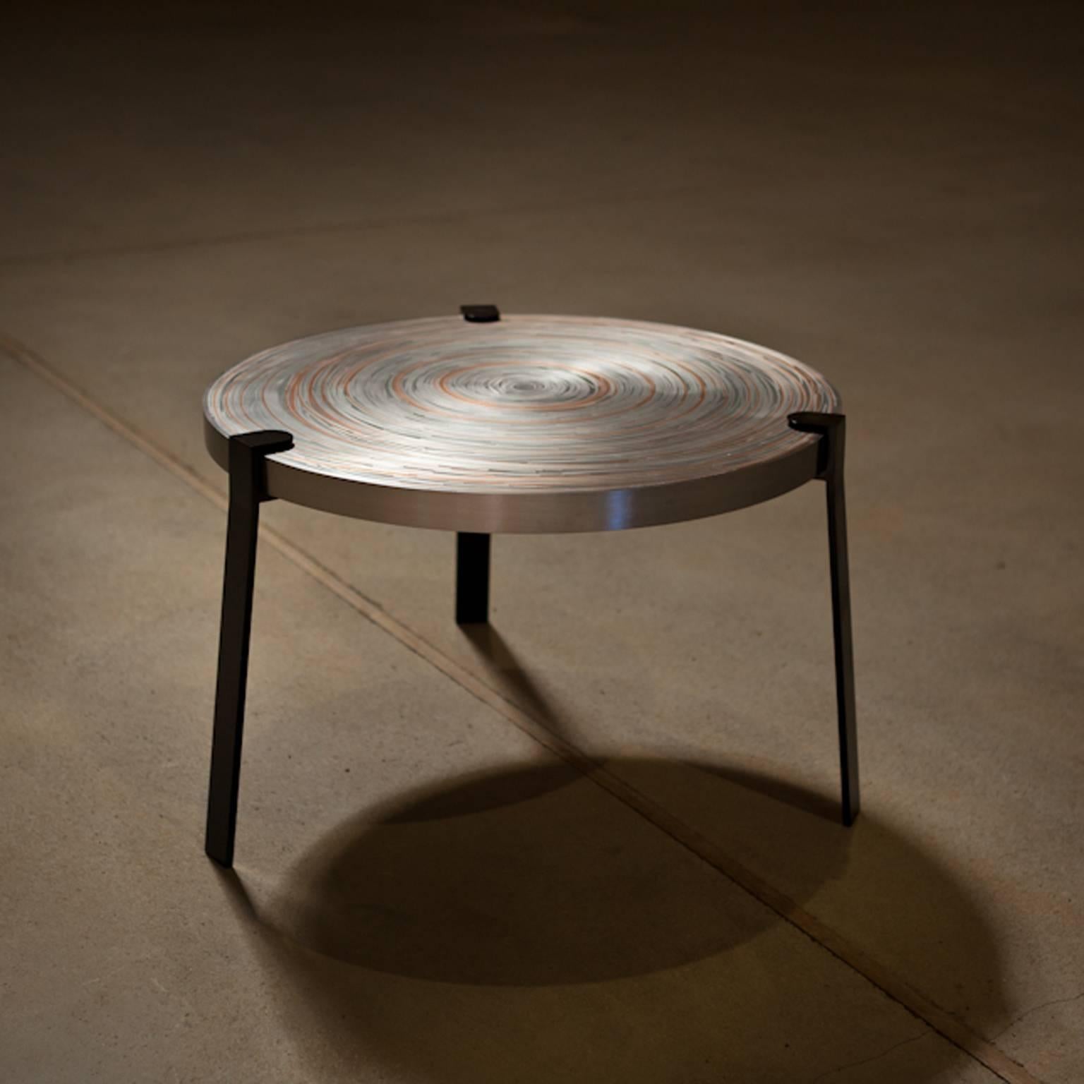Remetaled table is a series of two tables, consisting a layering composition of different types of metal sheets.
Layering brings depth in a object, offers room for surprise and gives the metal an innovative materiality. 
By nesting metal sheets in