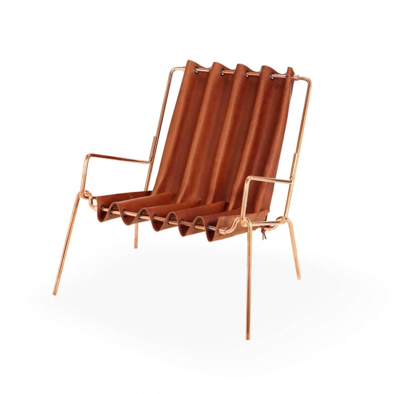 Using the undulating forms of a curtain as it hangs from a pole, this chair uses a mix of precision geometry and origami patterns to create a complex shape from a single piece of Tuscan vegetable tanned leather which was handmade in England.
A
