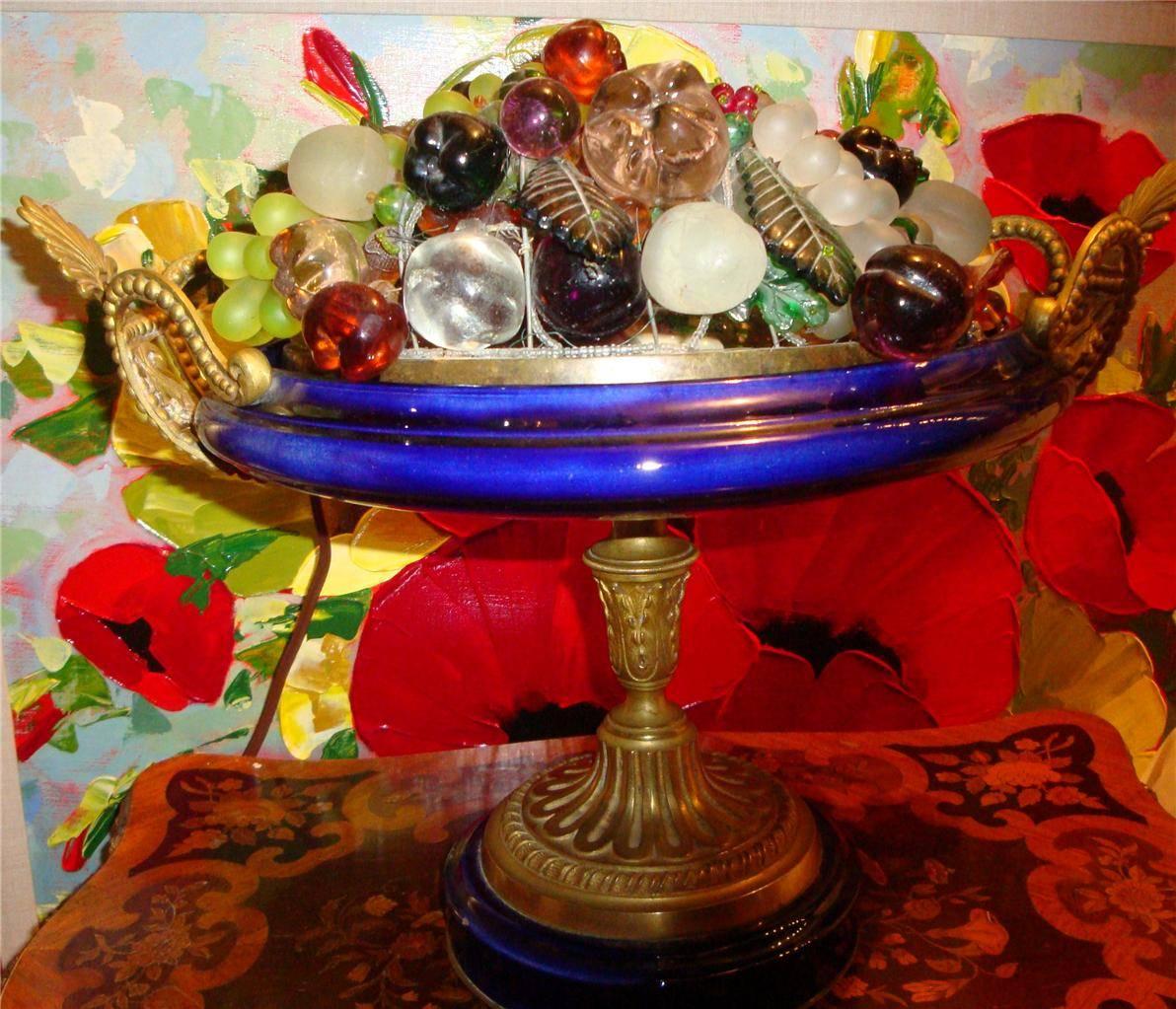 A rare large elaborate Czechoslovakian lamp. Lamp begins with a shade having a variety of fruit including grapes, apples, berries, cherries and leaves. Shade is supported by a blue porcelain stand with ornate bronze work. Fruit lamp, circa 1920s.