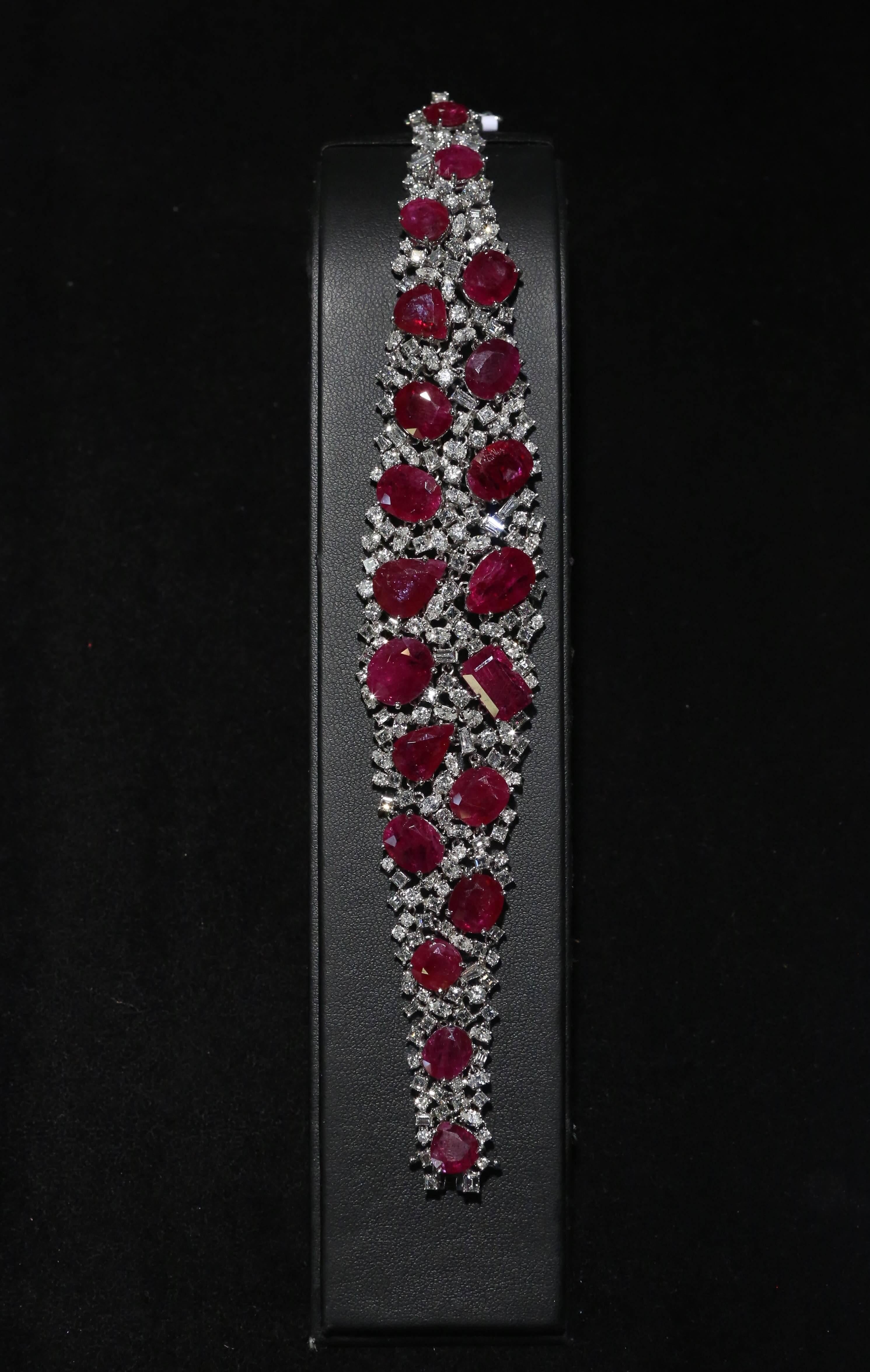 The following Item we are offering is this rare magnificent estate 60 CT 18-karat white gold large ruby and diamond wraparound bracelet. Taken out of an important Multi Million Dollar collection! Shown on a black background and white background to