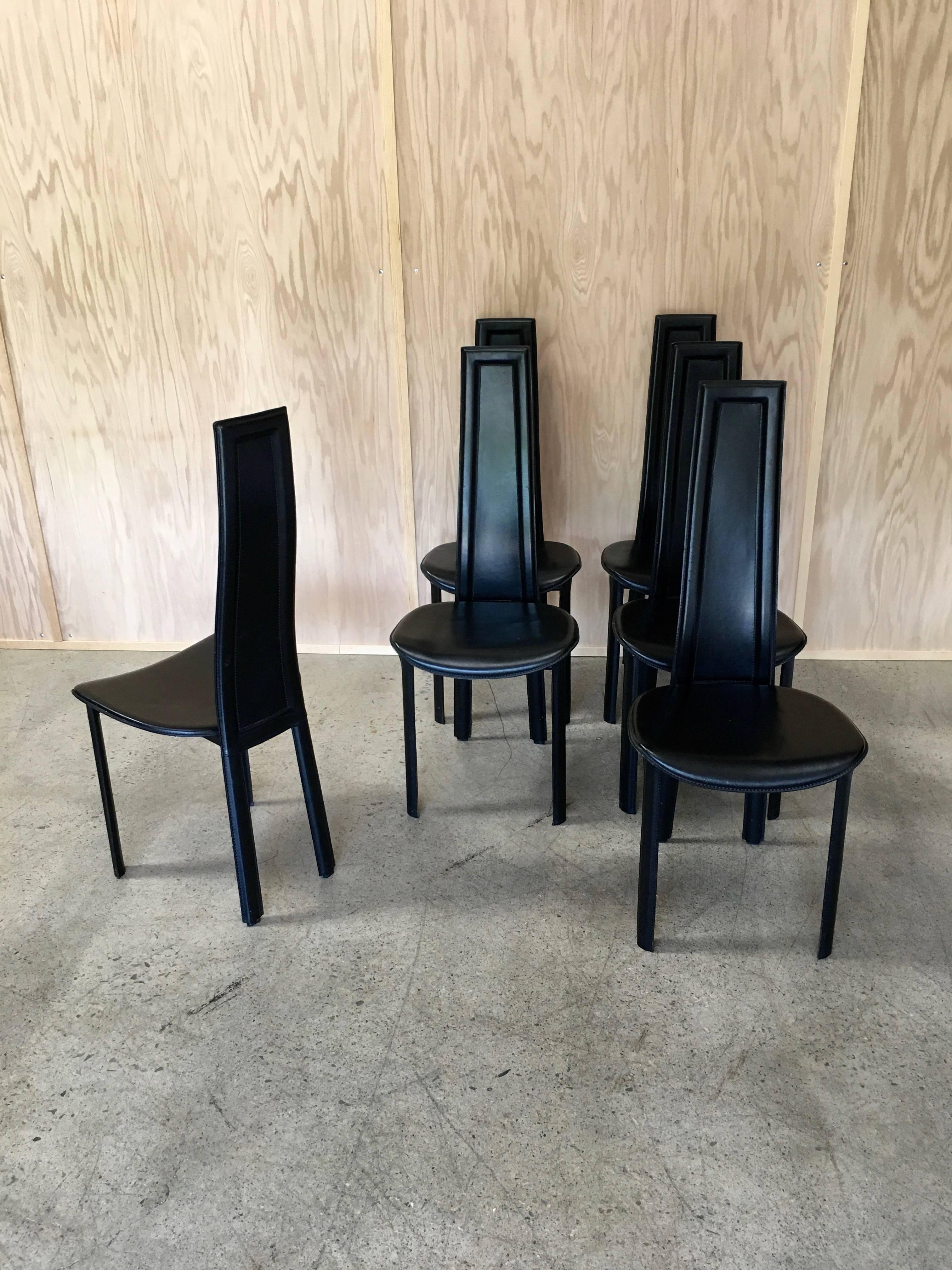 Set of six high back leather dining chairs.
