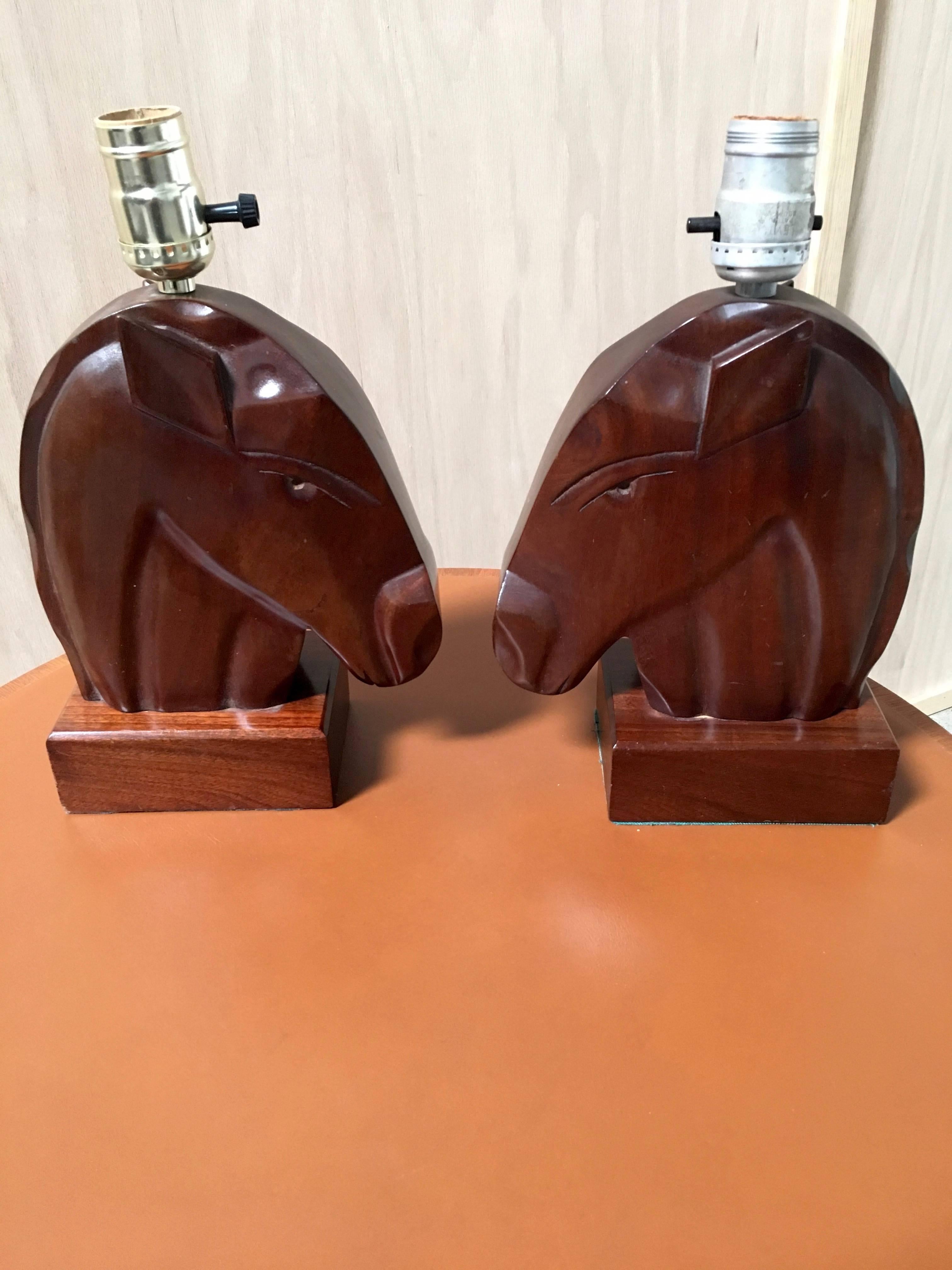 Pair of Mid-Century horse head lamps carved from solid mahogany
Made in Haiti.