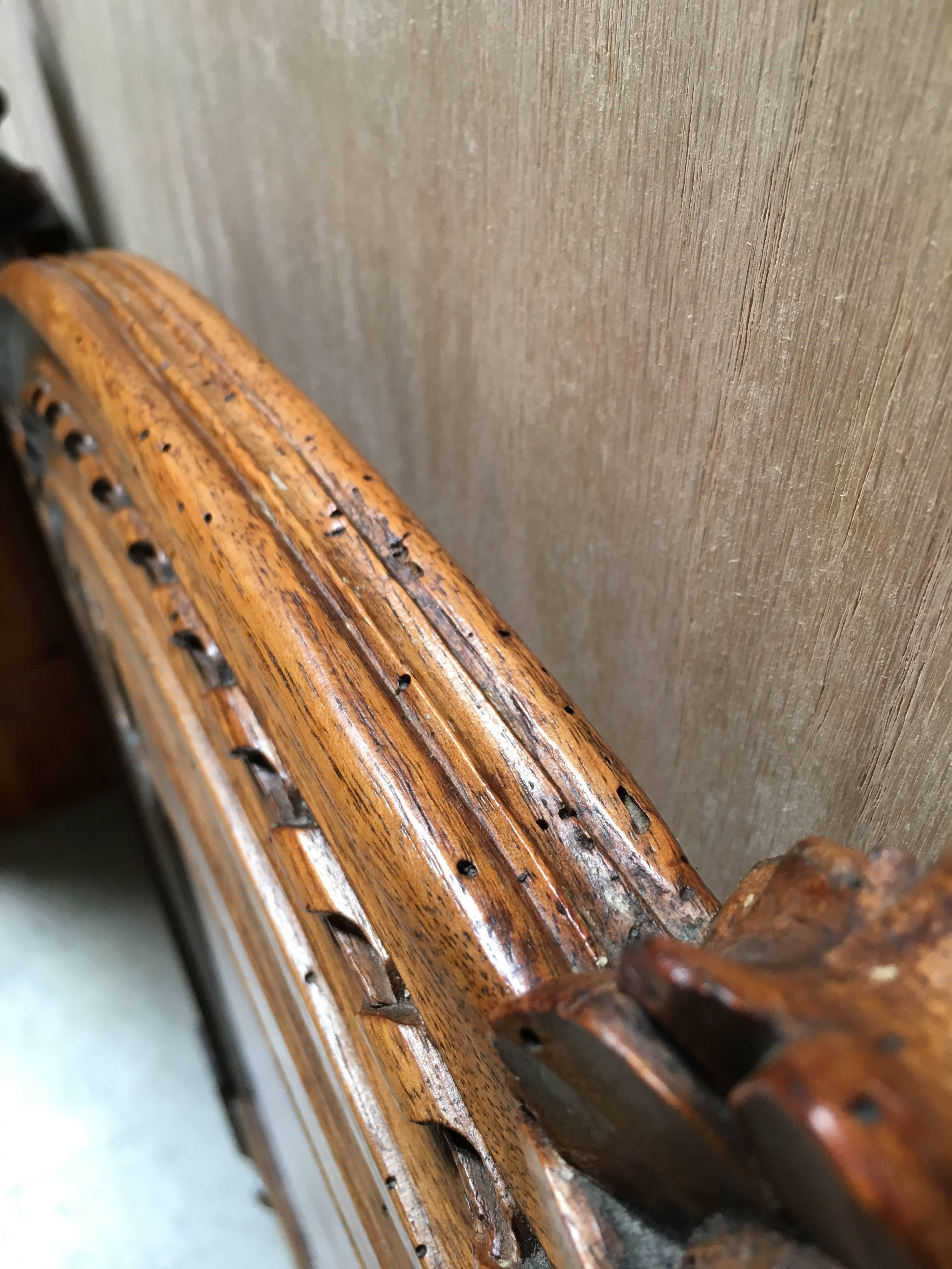 This is a pair of twin antique headboards conjoined into one king-size head board.