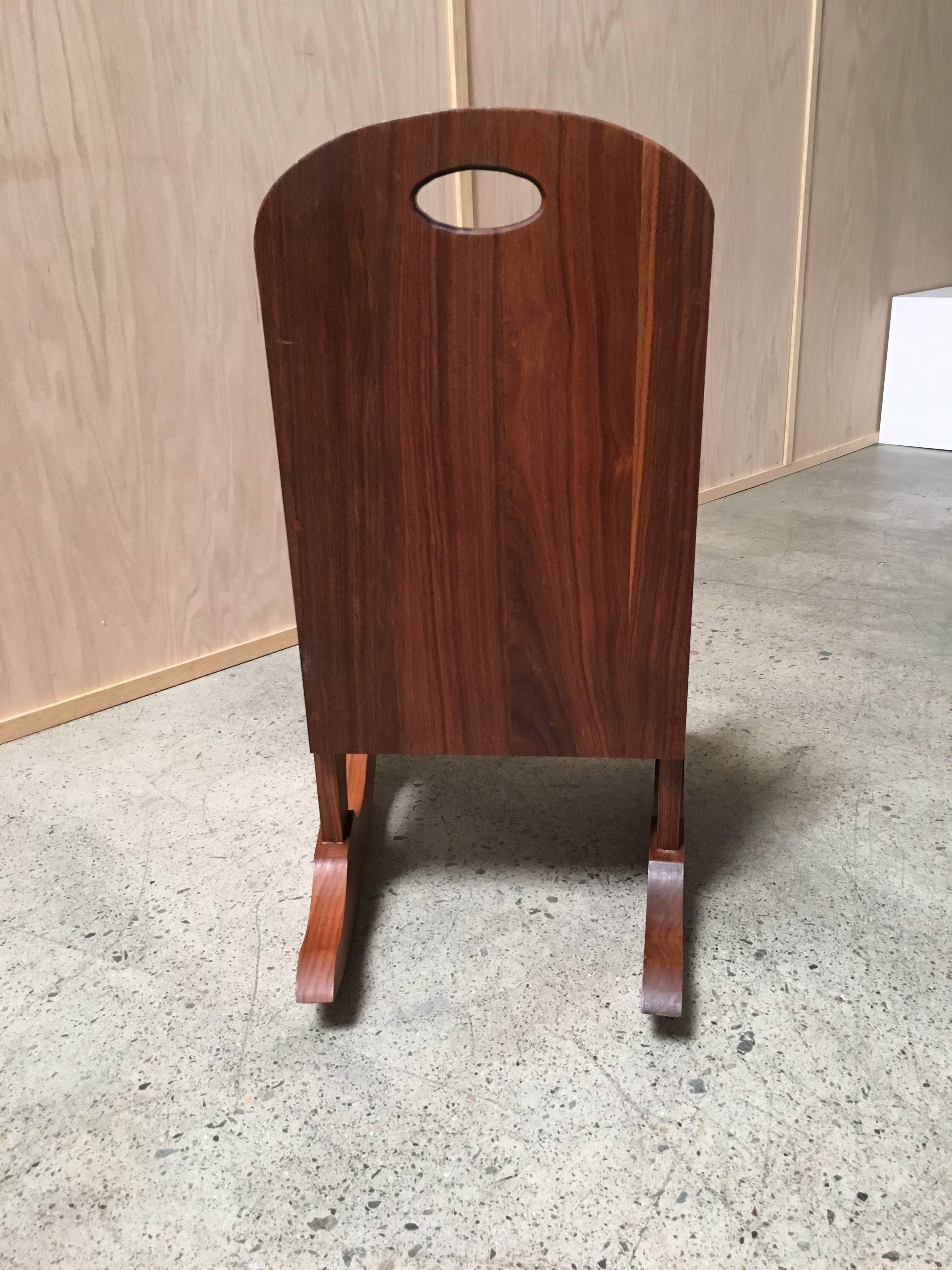 Studio crafted childs rocking chair in solid walnut by Bill Lucy.