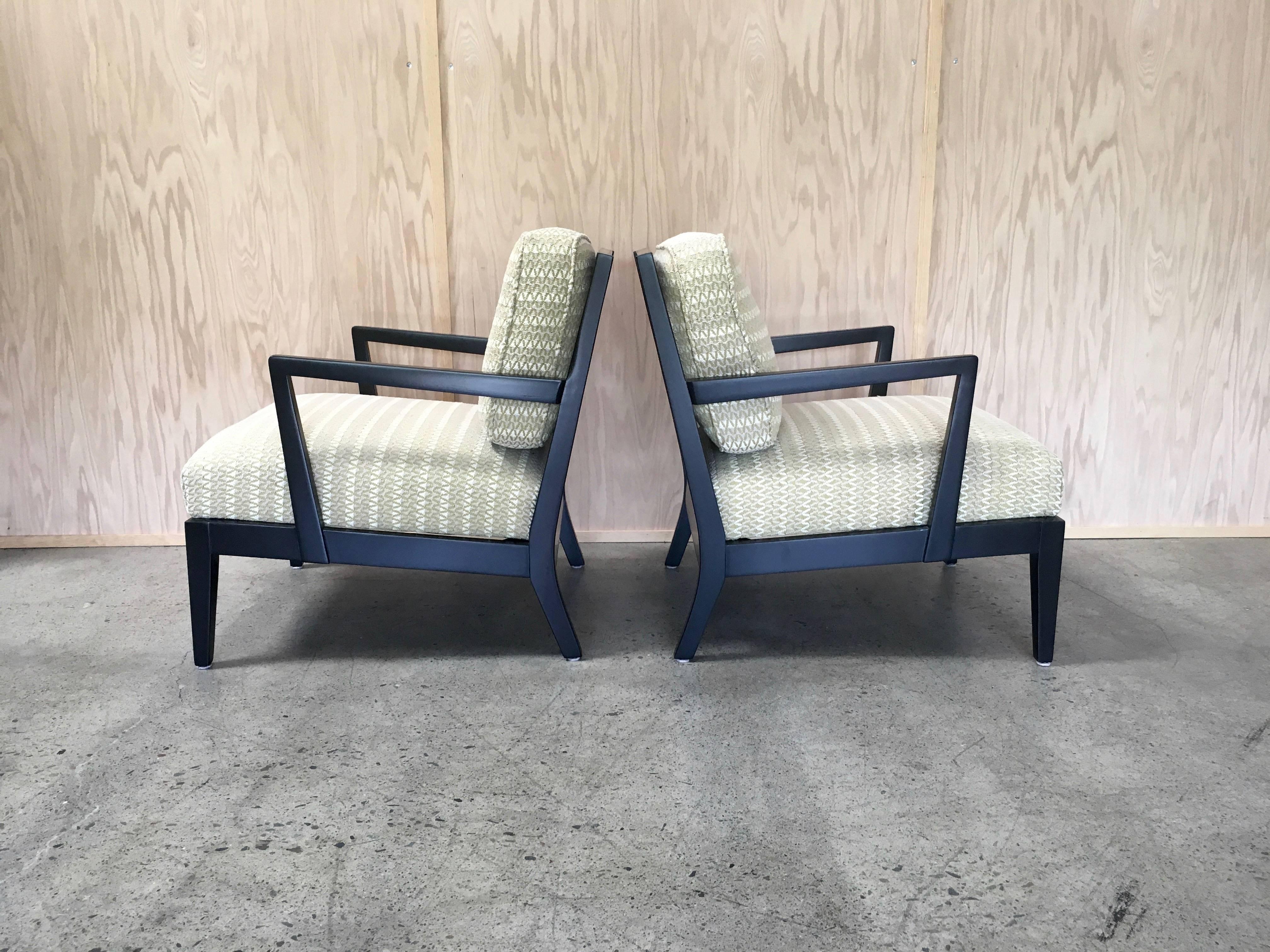 Very much in the style of Bill Haines pair of lounge chairs ebonized finish.