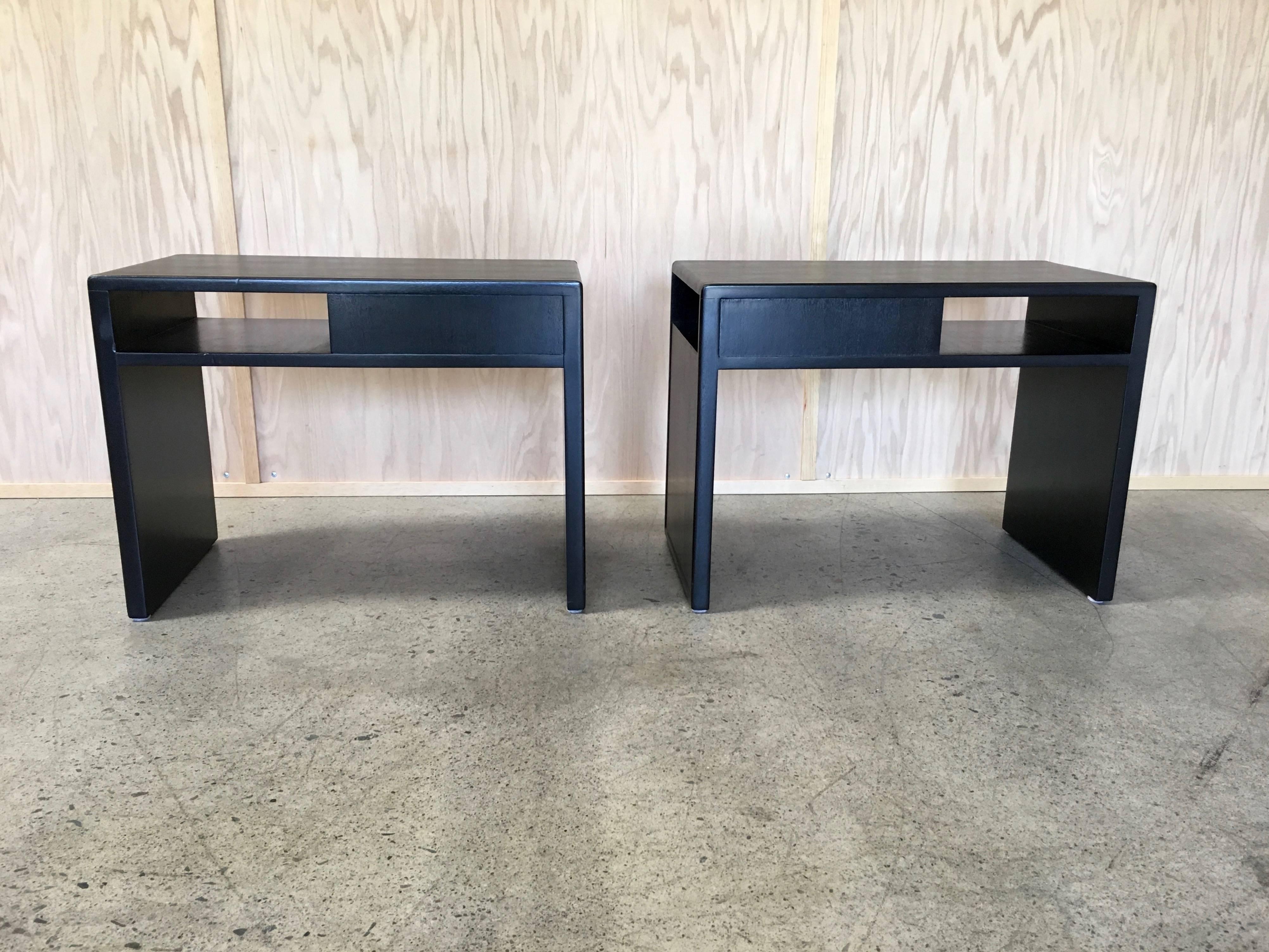 Edward Wormley for Dunbar end tables with black leather top and side.
