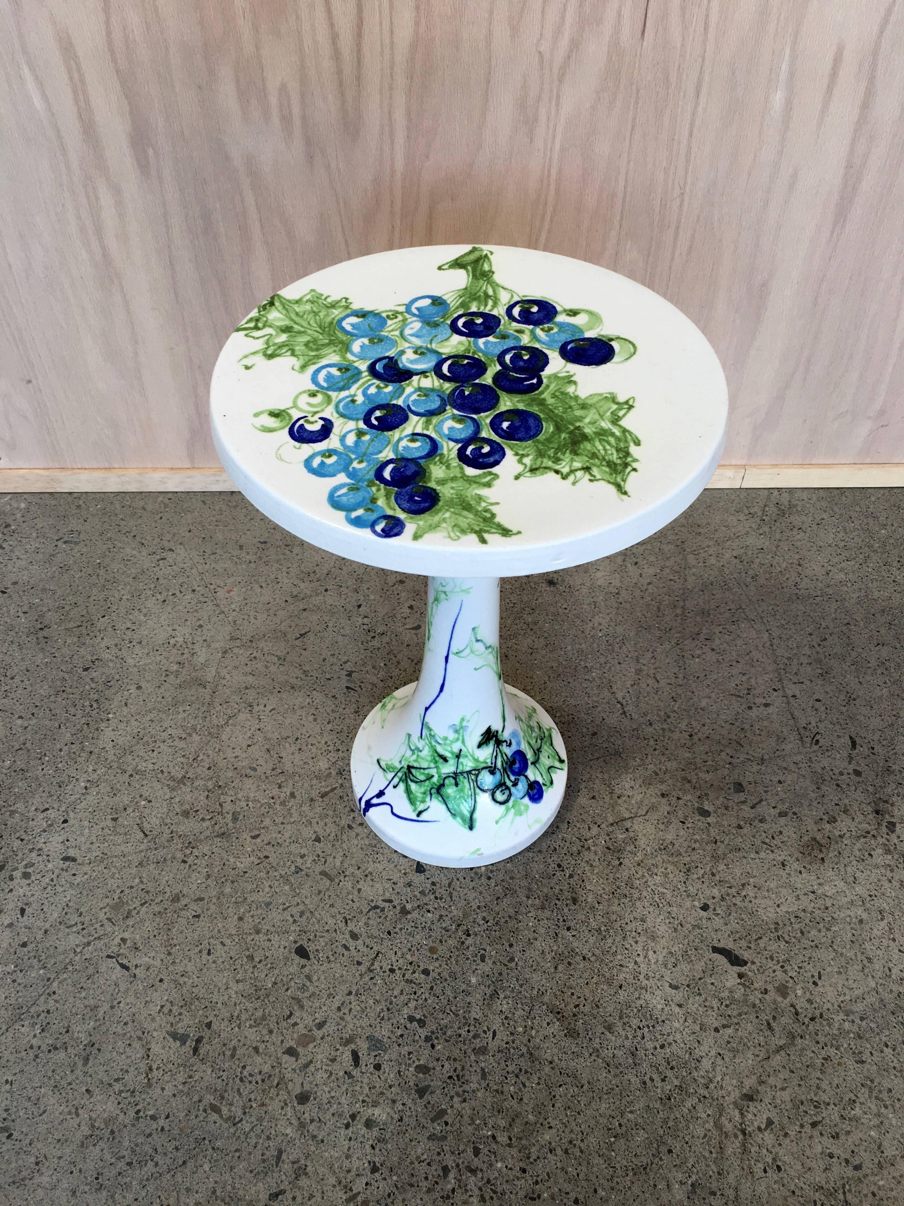 Raymor ceramic wine table with grapevine decoration.