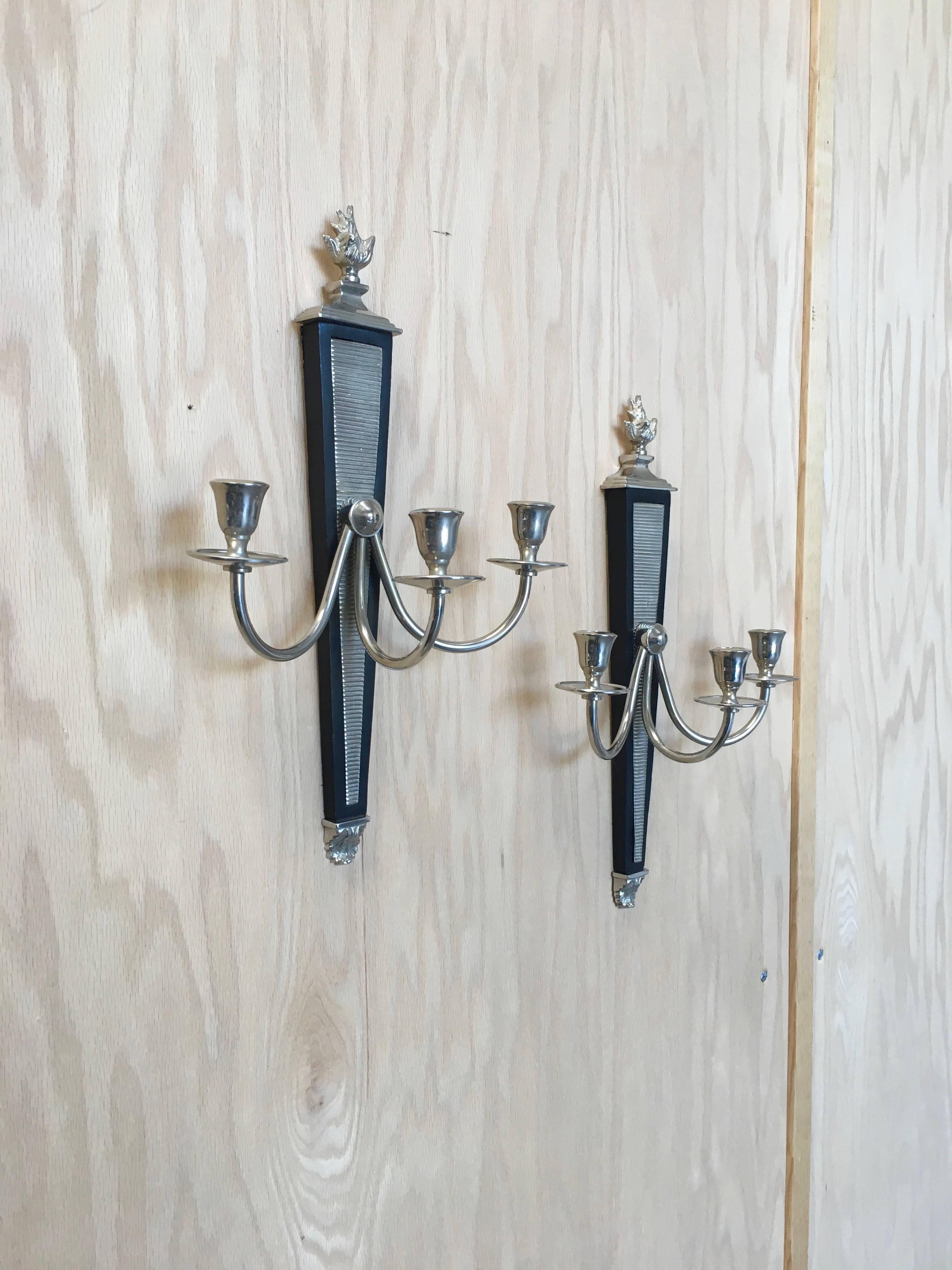 Pair of modernist sconces ebonized wood with nickel-plated brass.
These are for candles 