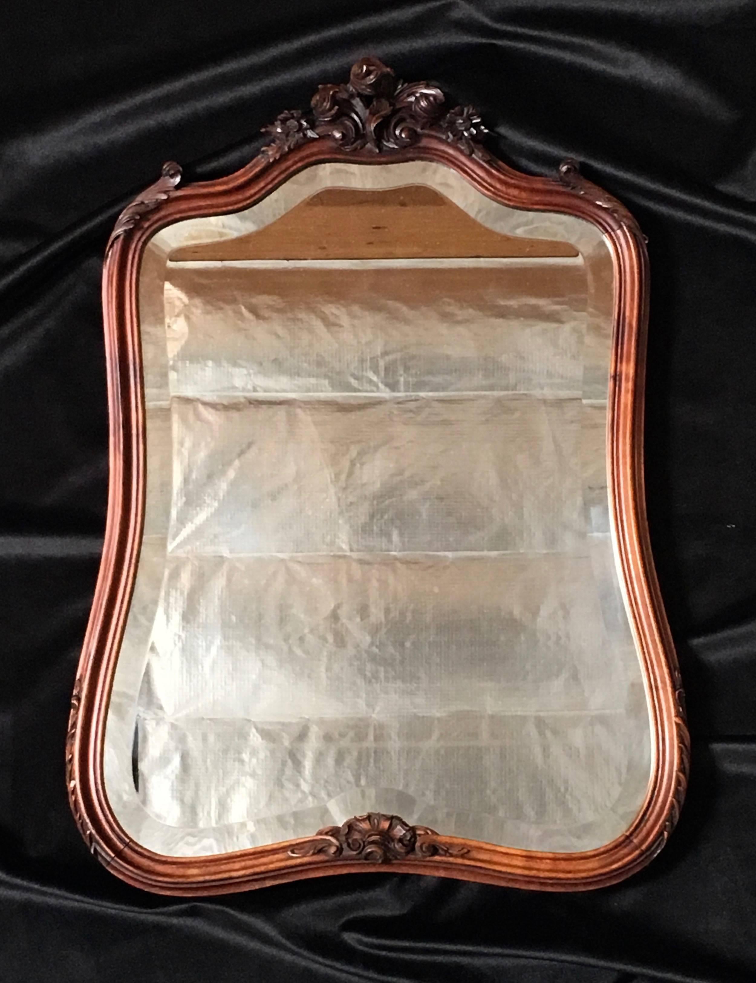 19th century antique hand-carved Louis XV style mirror bevelled glass with walnut frame.