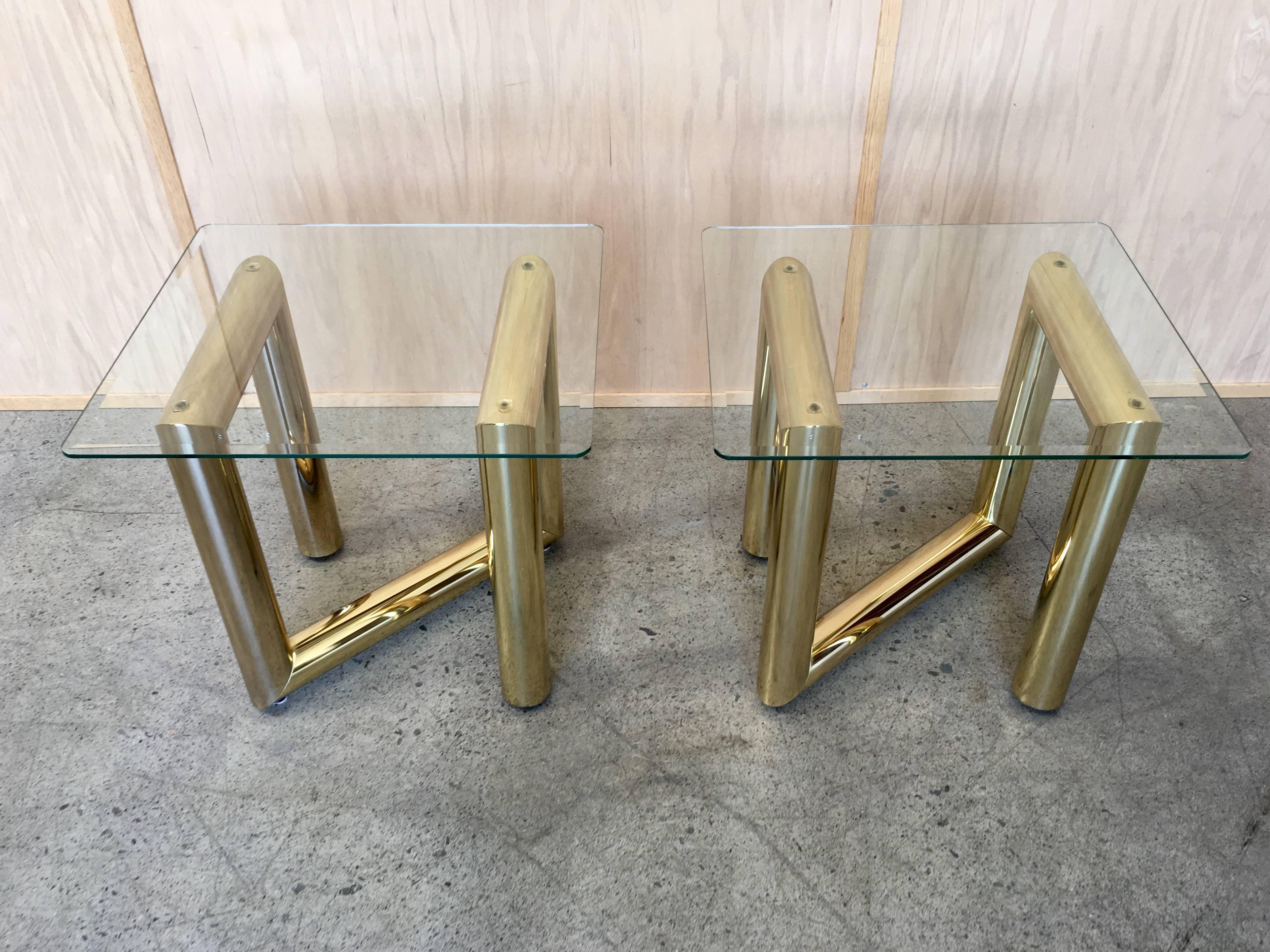 Pair of brass tubular side tables in the style of Karl Springer some light scratches on the glass and brass.