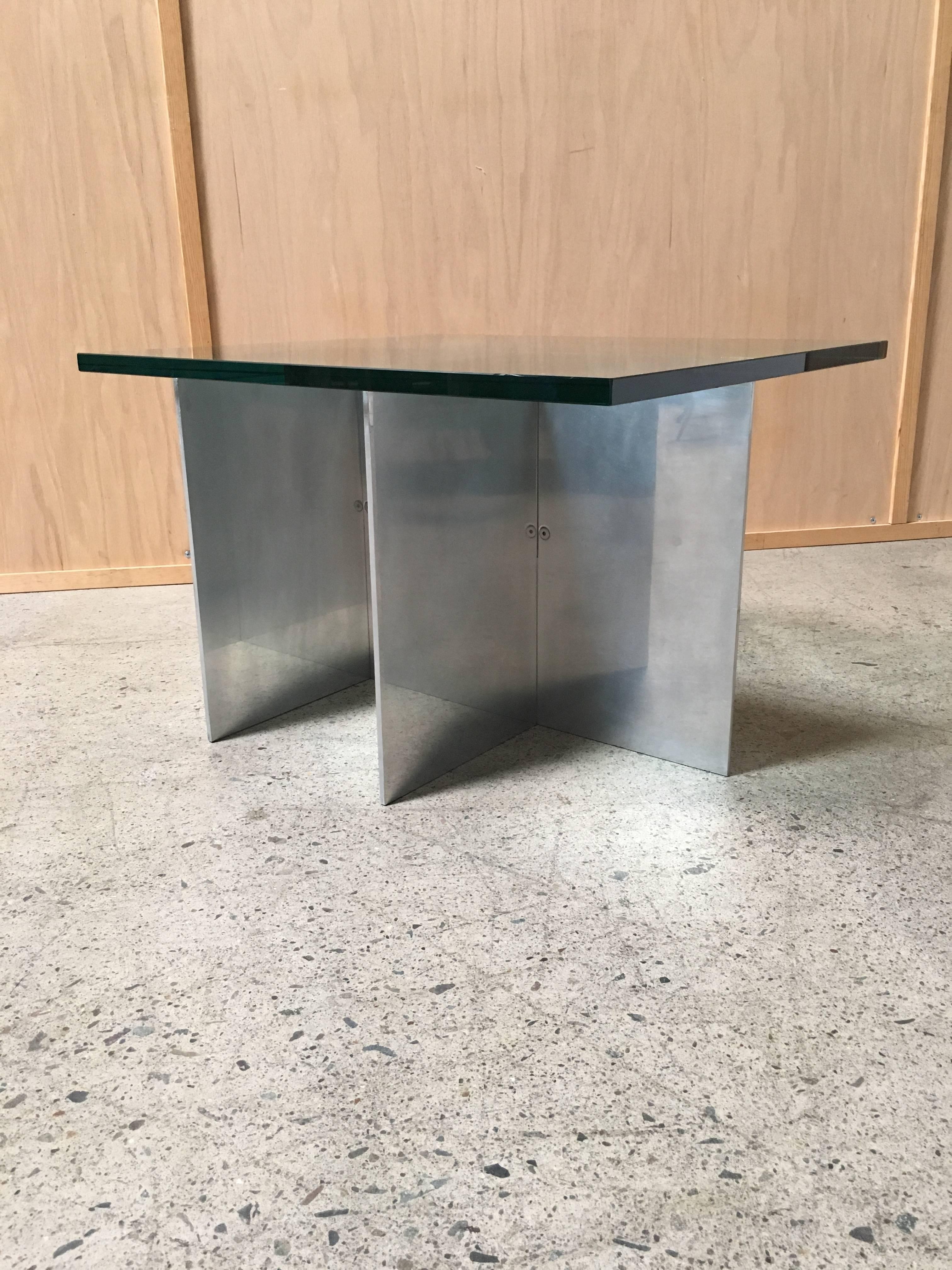 Aluminum with glass top end table for Habitat.