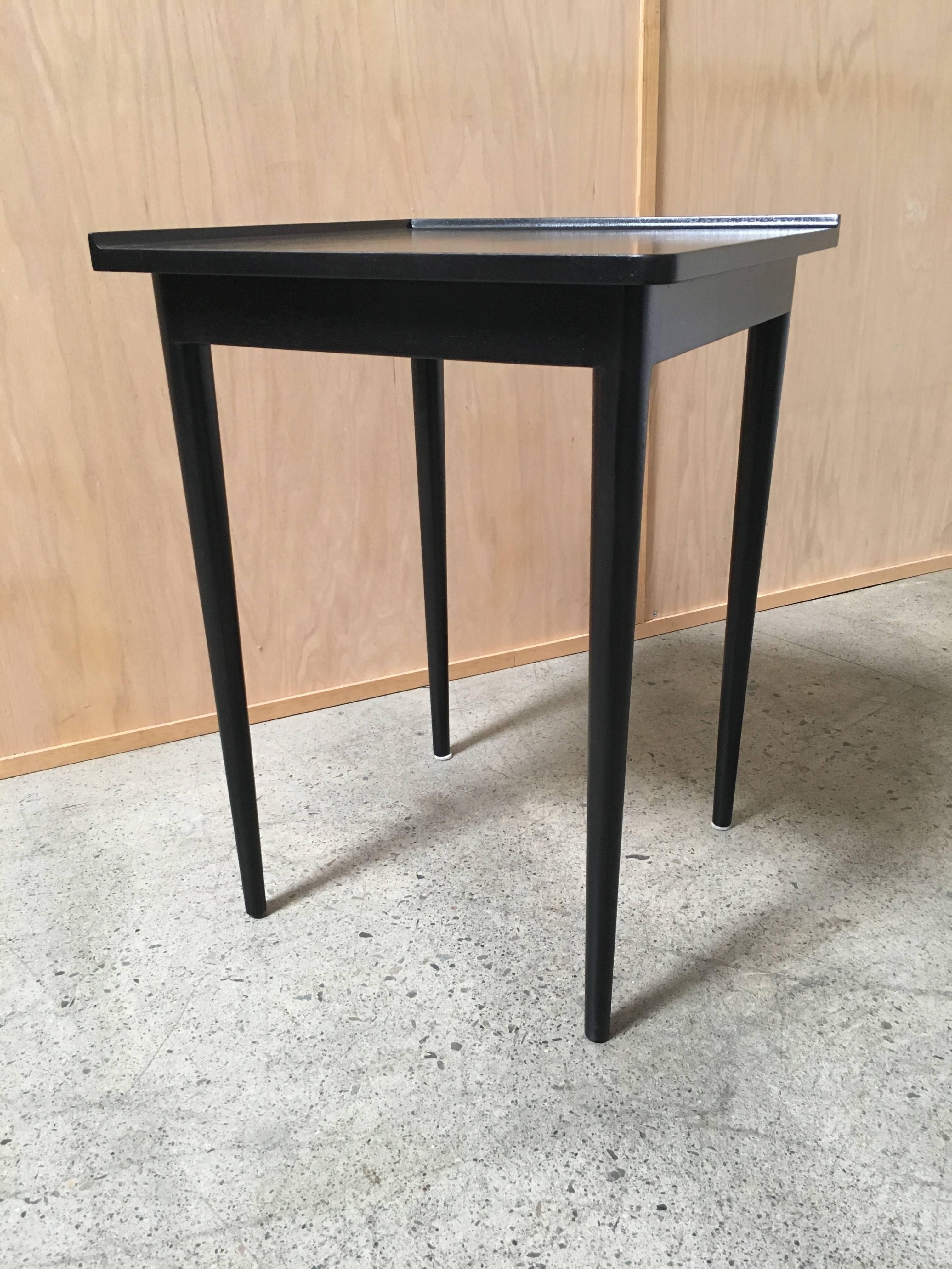 Ebonized corner table by Dunbar.