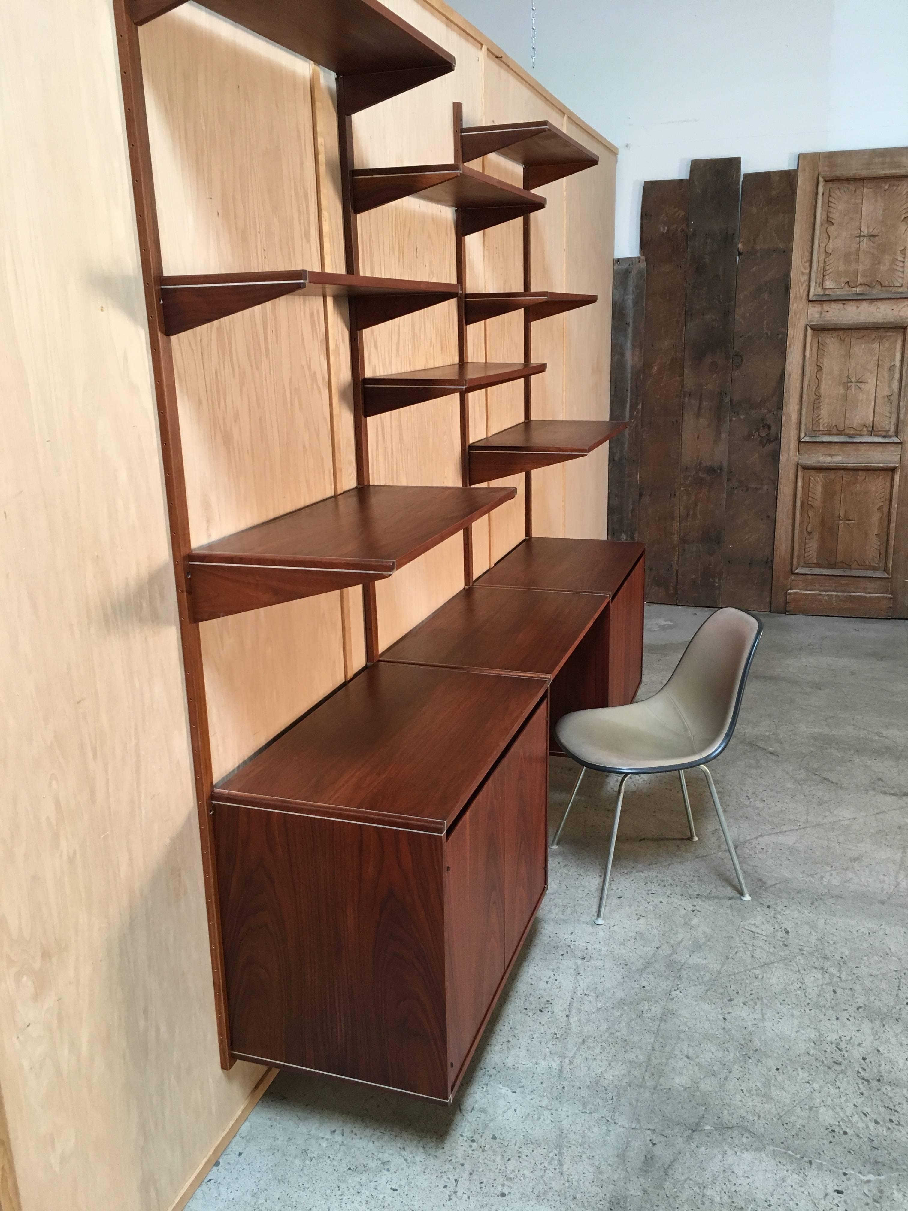 Walnut with aluminium trim floating wall unit or shelving unit by Barzilay of Los Angeles.
 
