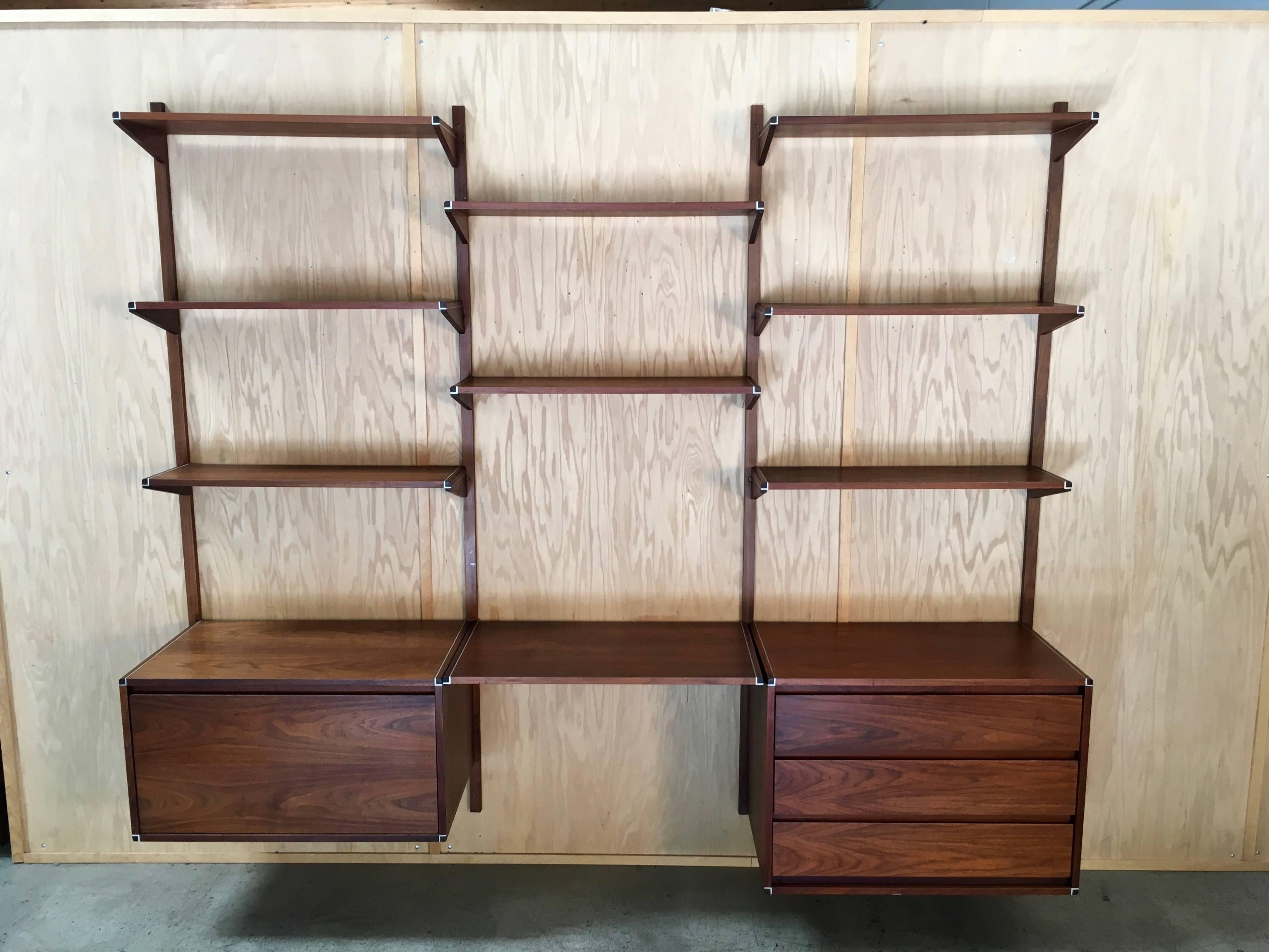 This is a great three-bay hanging unit with file cabinet and drawer cabinet and desk shelf for the home or office the other shelves can be used in any configuration.